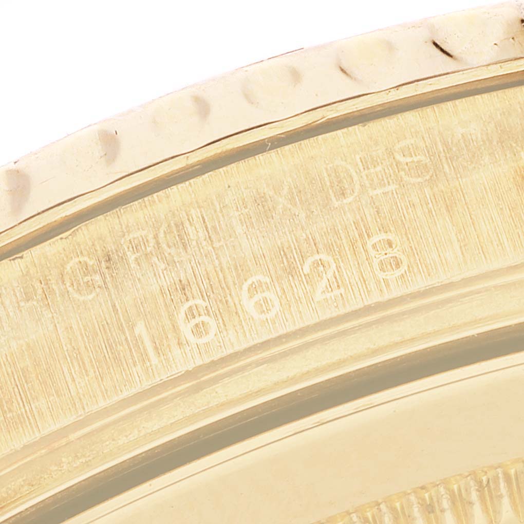 This is a close-up angle showing the engraved model number on the bezel of the Rolex Yacht-Master 16628 Men's Yellow Gold White Dial 16628 Men's Yellow Gold White Dial watch.