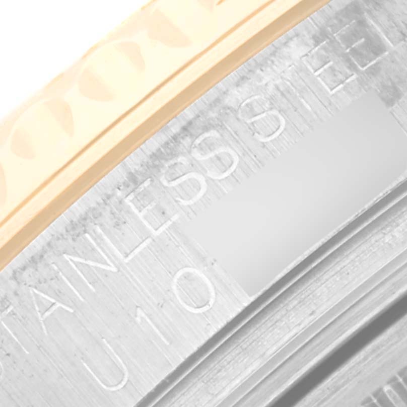 Close-up of the case engraving and bezel of a Rolex Yacht-Master 68623 Men
s Steel and Gold (two tone) Blue Dial 68623 Men
s Steel and Gold (two tone) Blue Dial watch, showing "STAINLESS STEEL" text.