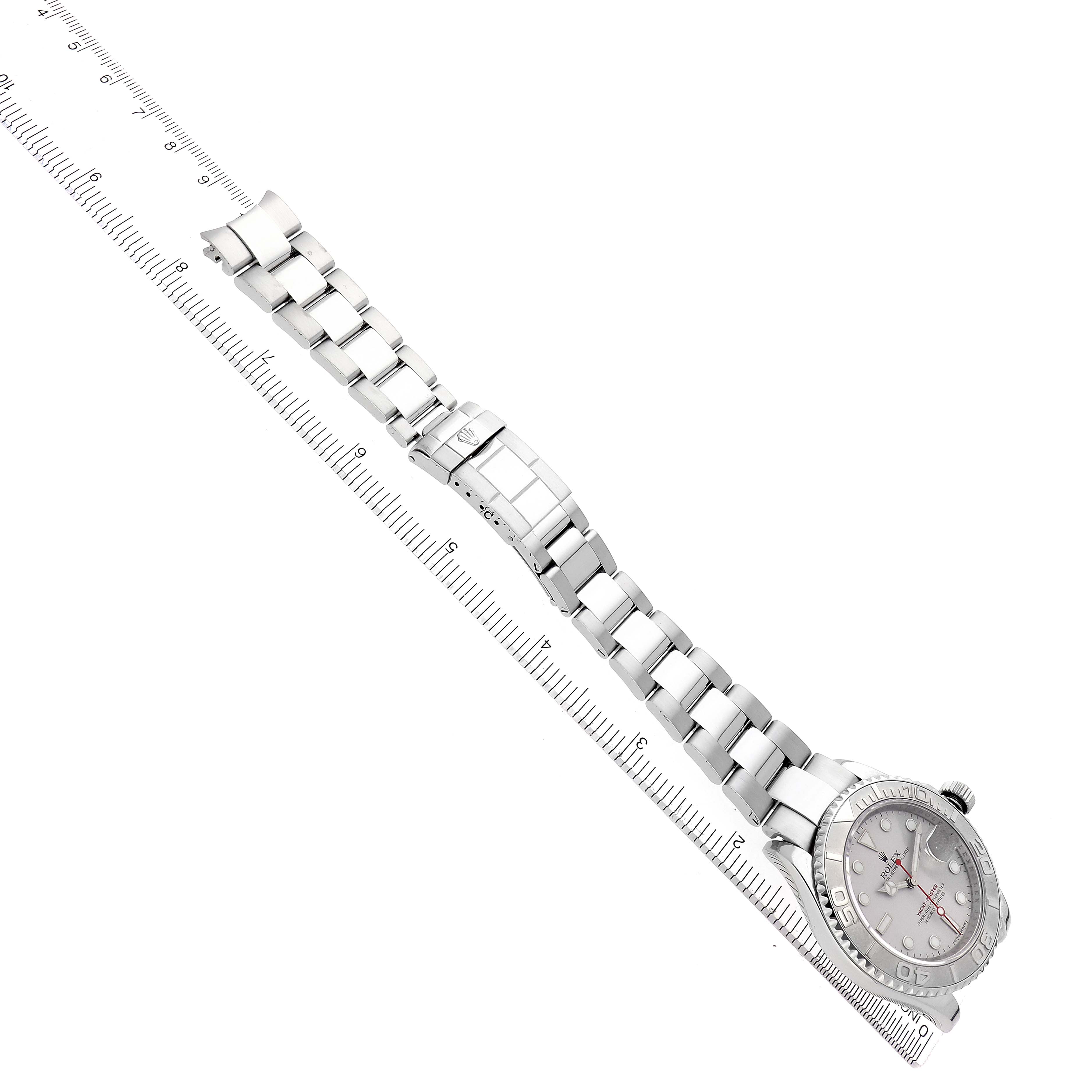 The Rolex Yacht-Master 16622 Men's Stainless Steel Silver Dial 16622 Men's Stainless Steel Silver Dial is shown at a high angle, displaying the full bracelet and face alongside a ruler for scale.