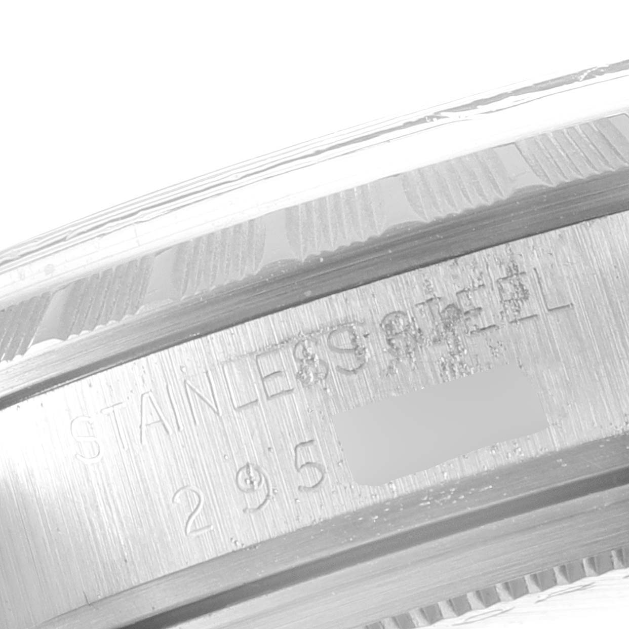 This close-up image of the Tudor Prince 94510 Men's Stainless Steel Silver Dial 94510 Men's Stainless Steel Silver Dial model shows the engraved stainless steel caseback.