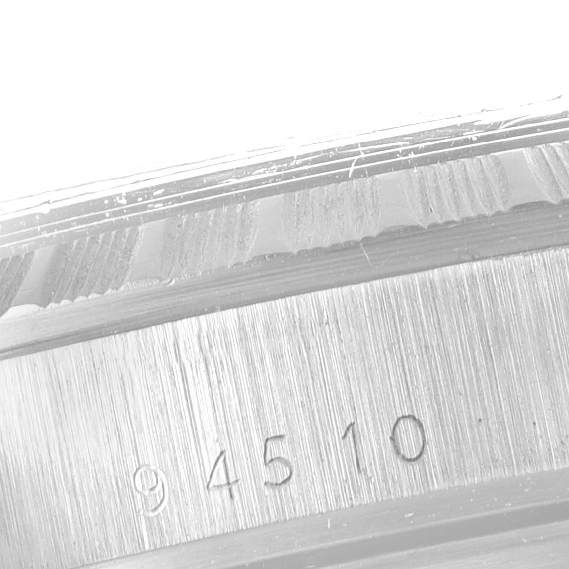 The image shows a close-up of the serial number on the bezel edge of the Tudor Prince 94510 Men's Stainless Steel Silver Dial 94510 Men's Stainless Steel Silver Dial watch.