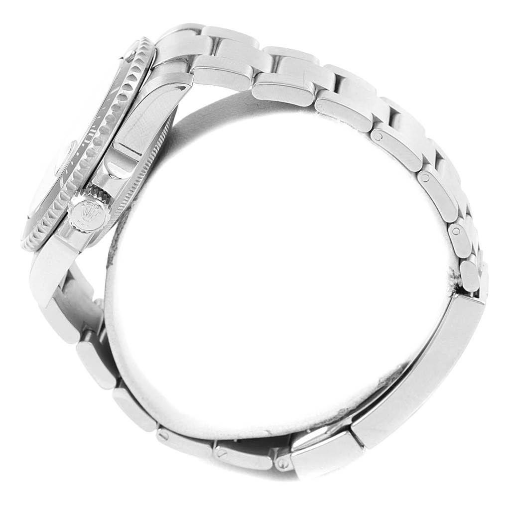 This side view of a Rolex 116610 Men's Stainless Steel Black Dial 116610 Men's Stainless Steel Black Dial Submariner Cerachrom Bezel, Black Dial Steel Mens Watch 116610 shows the watch case, crown, and bracelet.