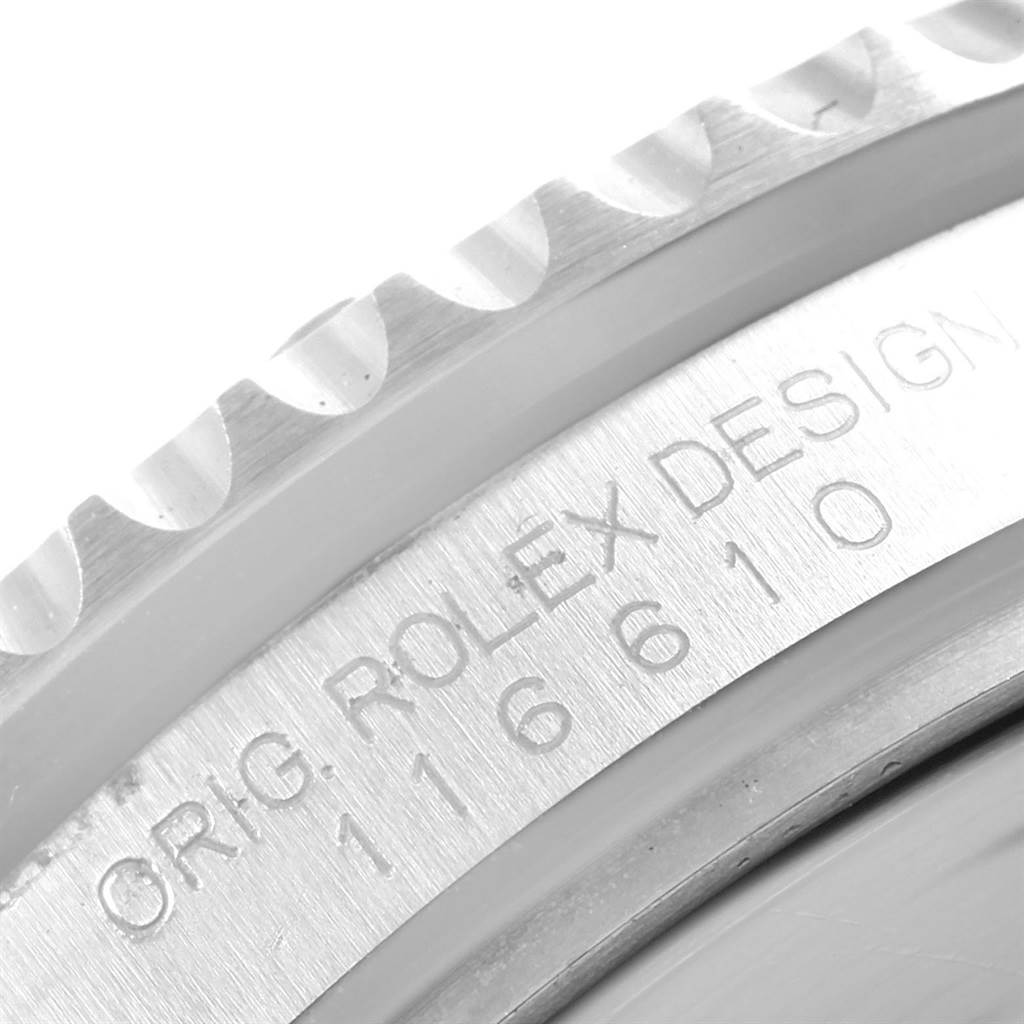 The image shows a close-up of the caseback and bezel edge of the Rolex 116610 Men's Stainless Steel Black Dial 116610 Men's Stainless Steel Black Dial Submariner Cerachrom Bezel Black Dial Steel Mens Watch model 116610.