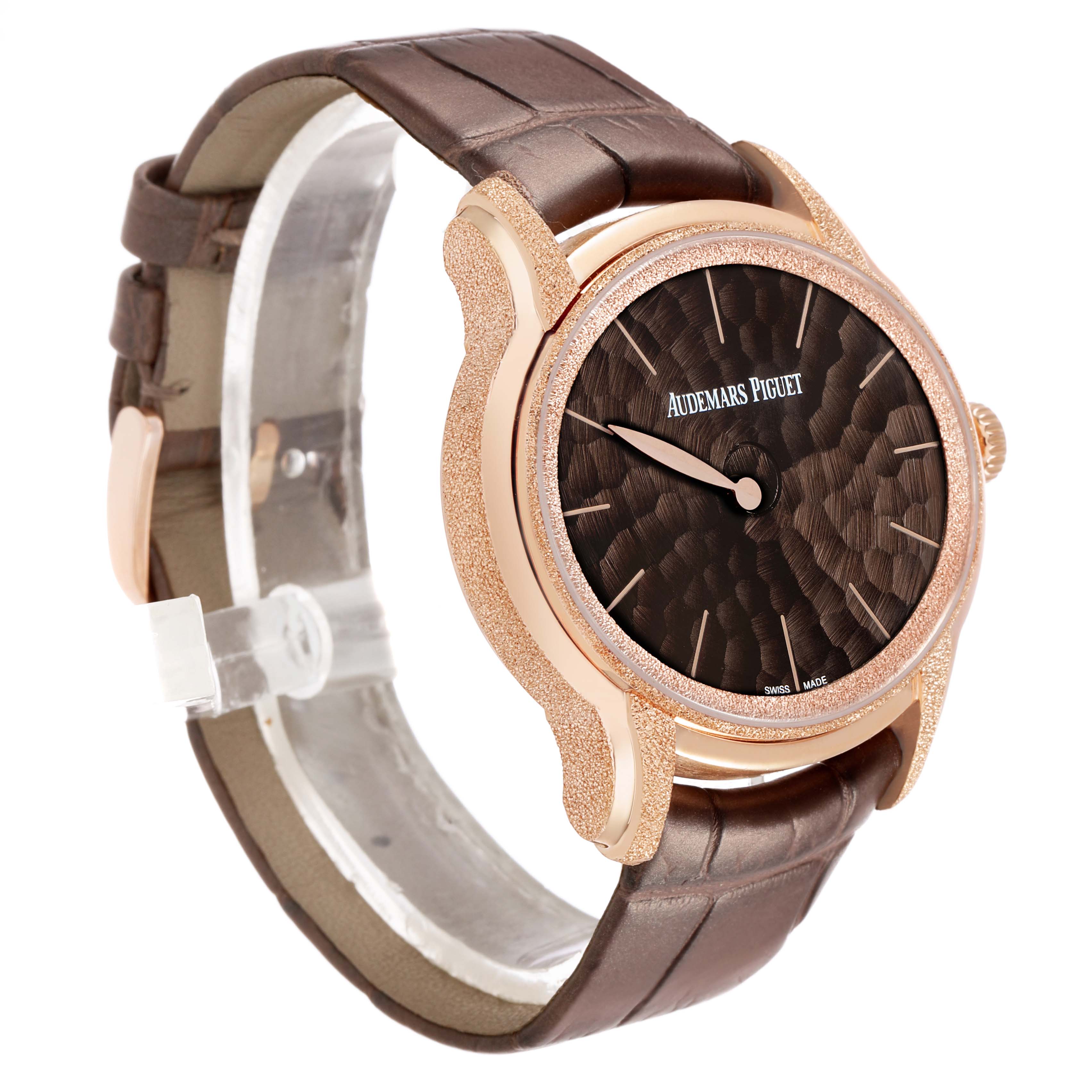 The Audemars Piguet Millenary 77266OR Women's Rose Gold Brown Dial watch is shown at a three-quarter angle, highlighting its textured dial, rose gold case, and brown leather strap.