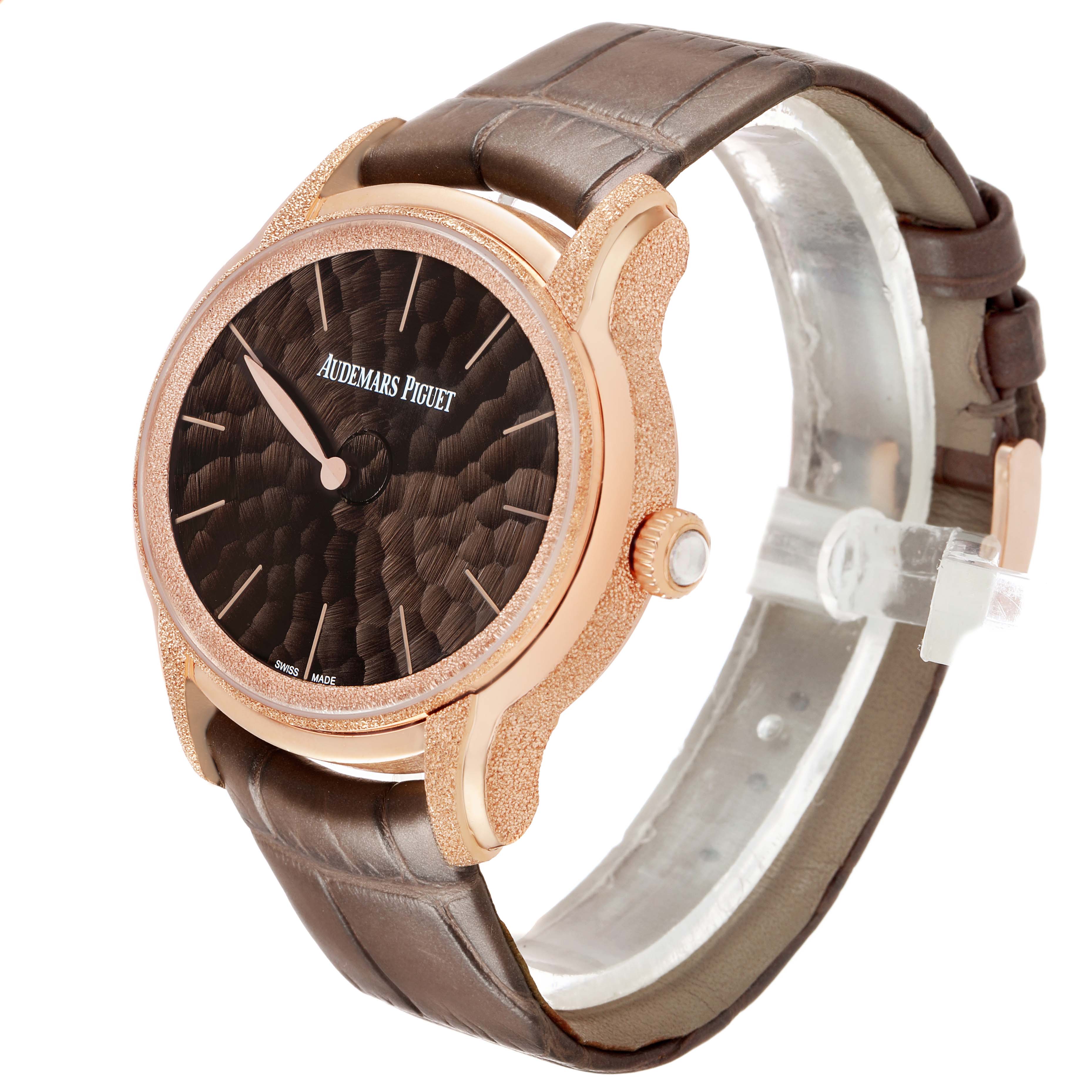 The Audemars Piguet Millenary 77266OR Women's Rose Gold Brown Dial watch is shown at a slight angle, highlighting its textured case, crown, dial, and leather strap.