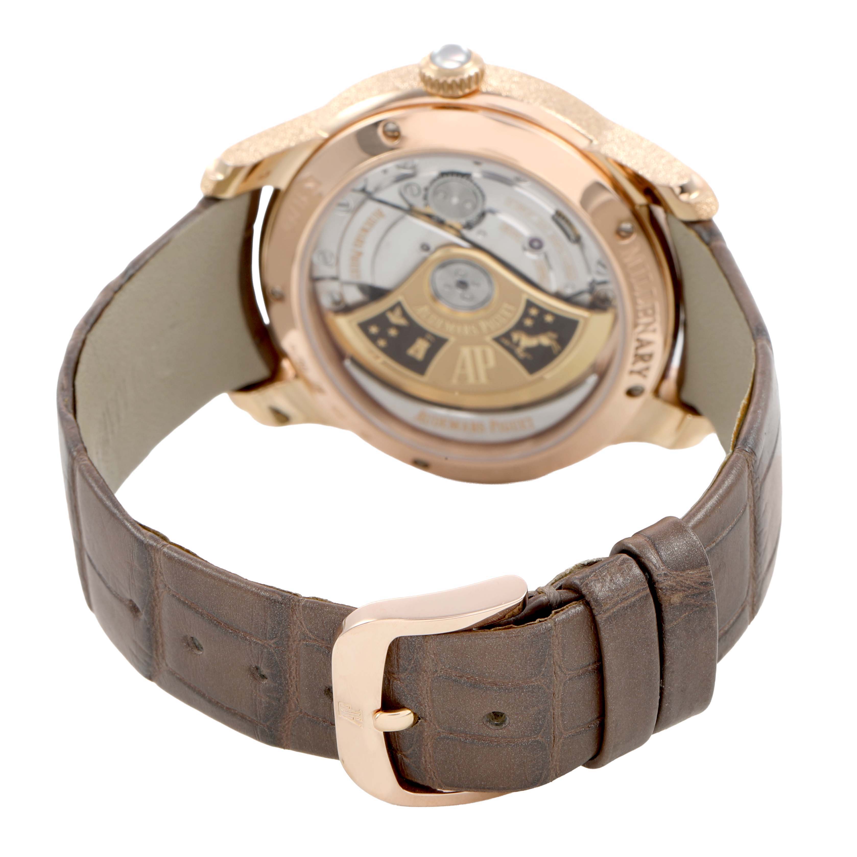 The image shows the back of the Audemars Piguet Millenary 77266OR Women's Rose Gold Brown Dial watch, highlighting the movement and a brown leather strap with a buckle.
