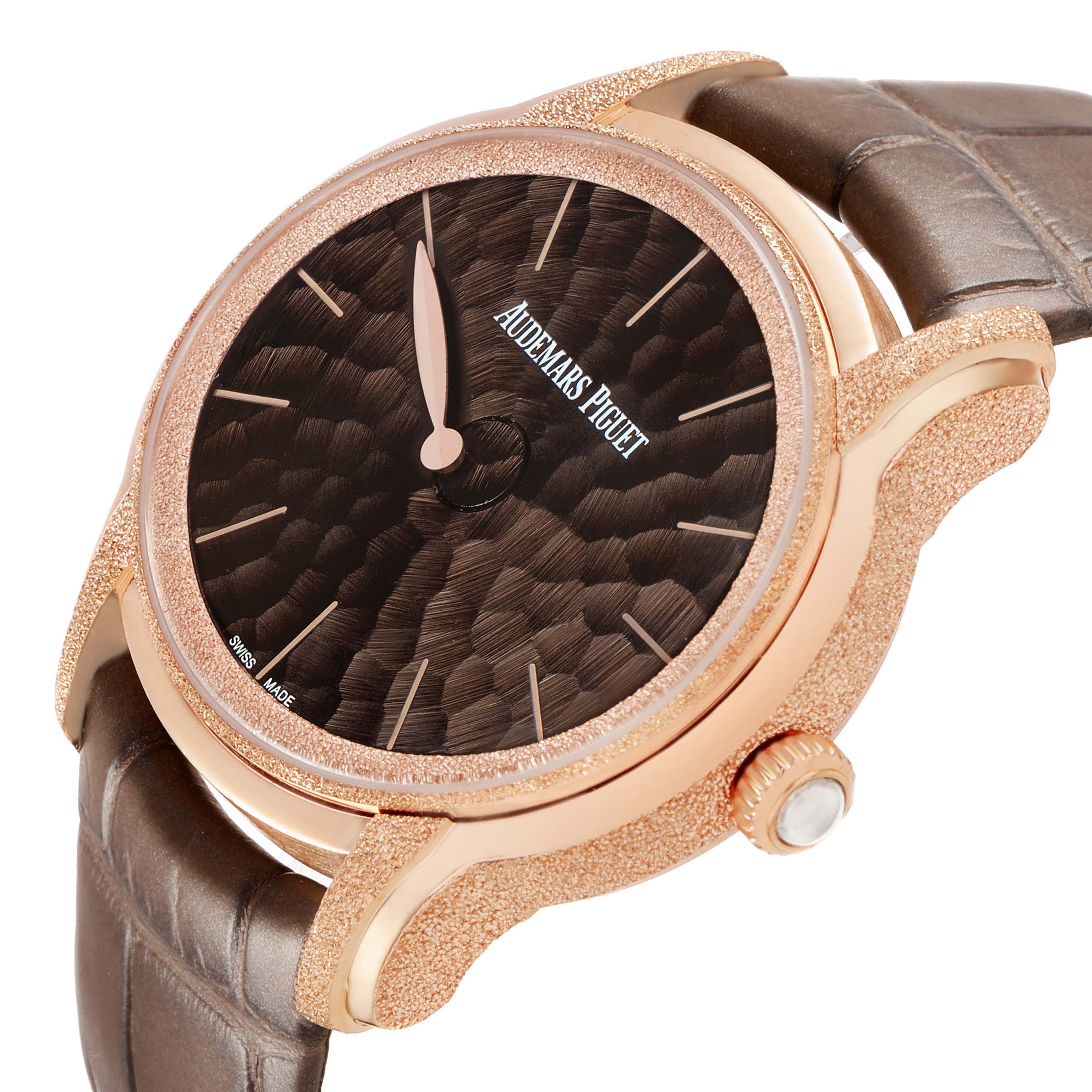 The Audemars Piguet Millenary 77266OR Women's Rose Gold Brown Dial watch is shown at a three-quarter angle, highlighting the textured dial, rose gold case, and leather strap.