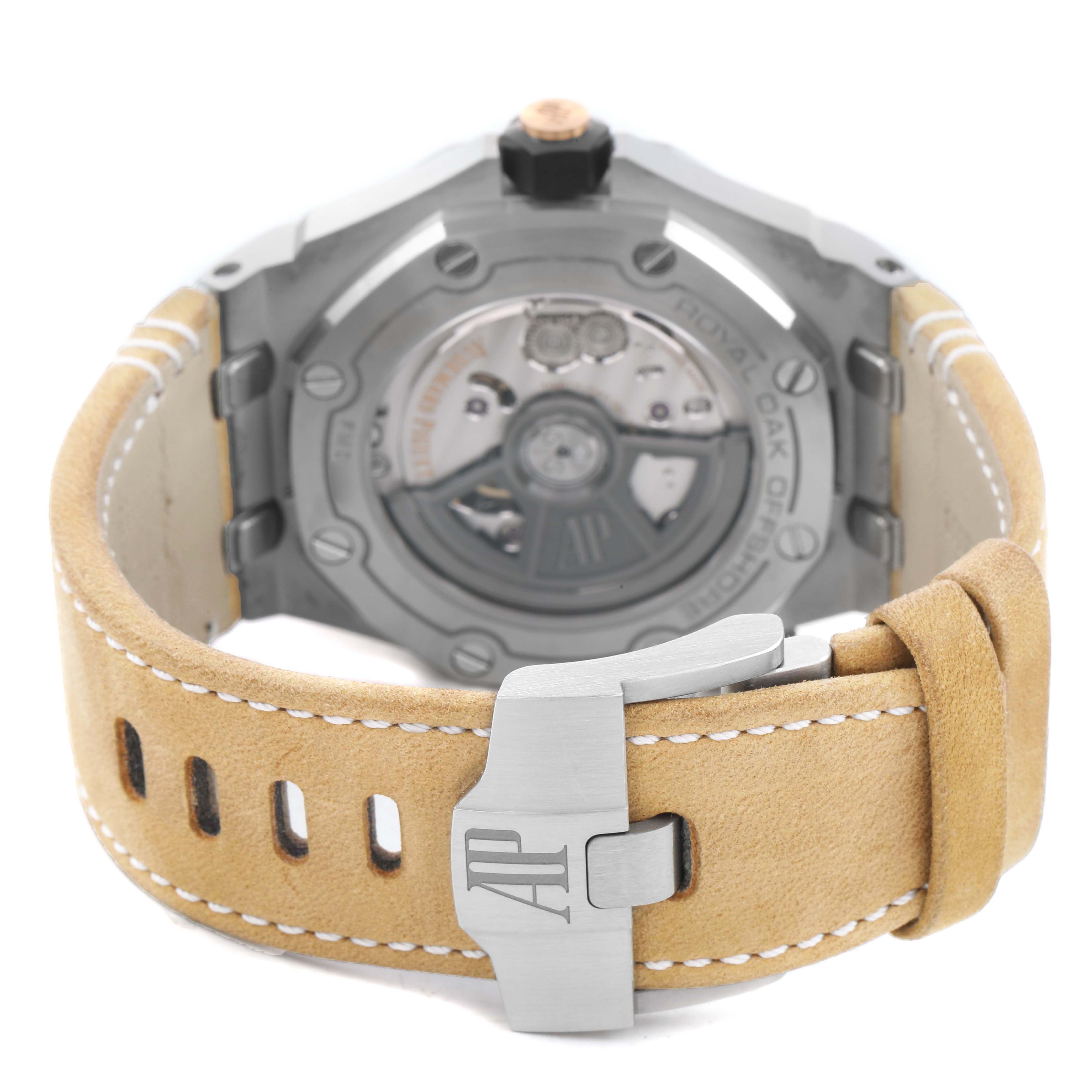 The image shows the back view of an Audemars Piguet Royal Oak Offshore 15720ST Men's Stainless Steel Green Dial watch, highlighting the case back and beige strap with the clasp.