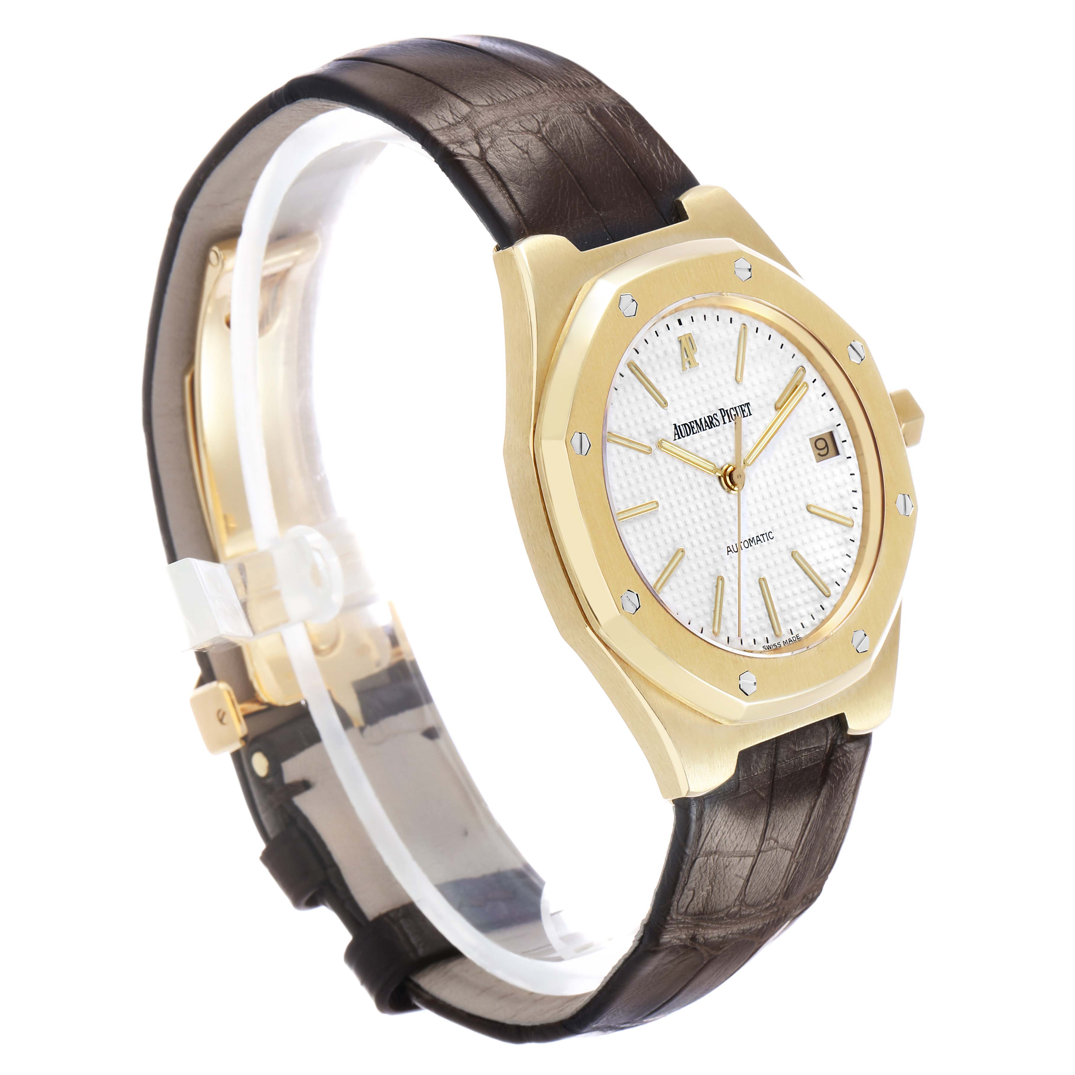 The Audemars Piguet Royal Oak 14800BA Men's Stainless Steel White Dial watch is shown at a side angle, highlighting its gold case, dial, and leather strap.