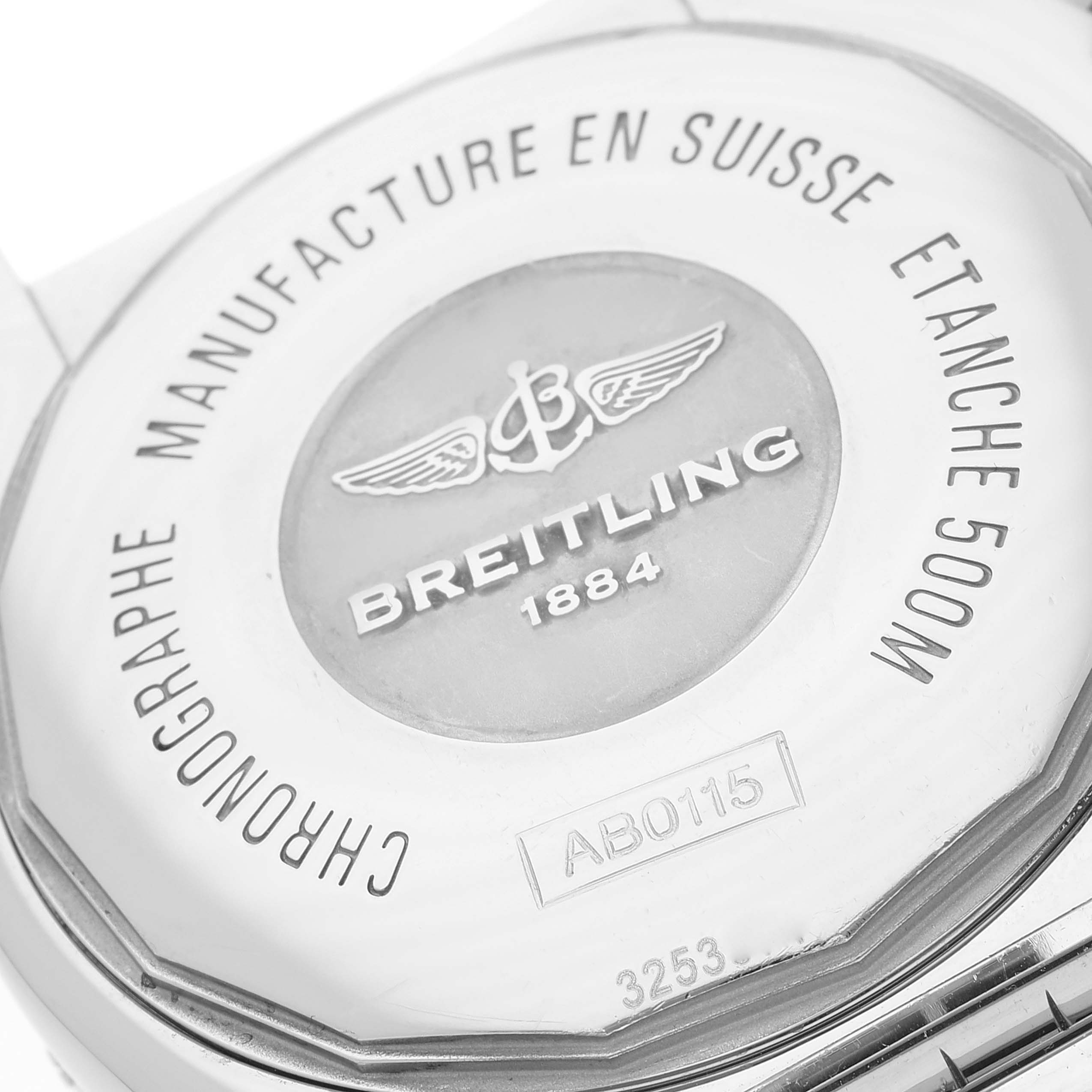 This image shows the back case of the Breitling Chronomat AB0115 Men
s Stainless Steel Blue Dial AB0115 Men
s Stainless Steel Blue Dial watch, highlighting its engravings and brand insignia.