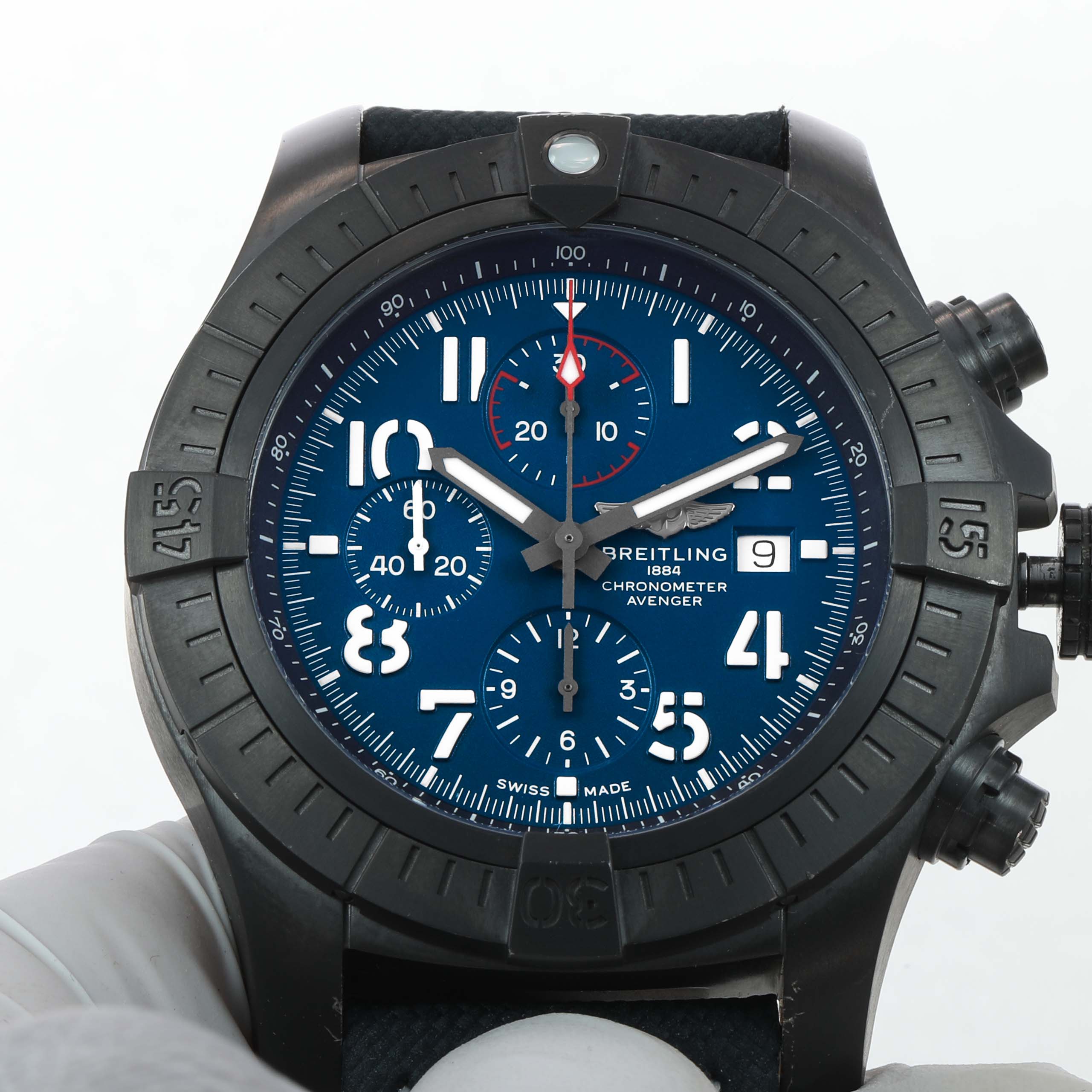 The image shows a front view of a Breitling Avenger V13375101C1X2 Men's Titanium Blue Dial watch, highlighting the dial, bezel, and chronograph buttons.