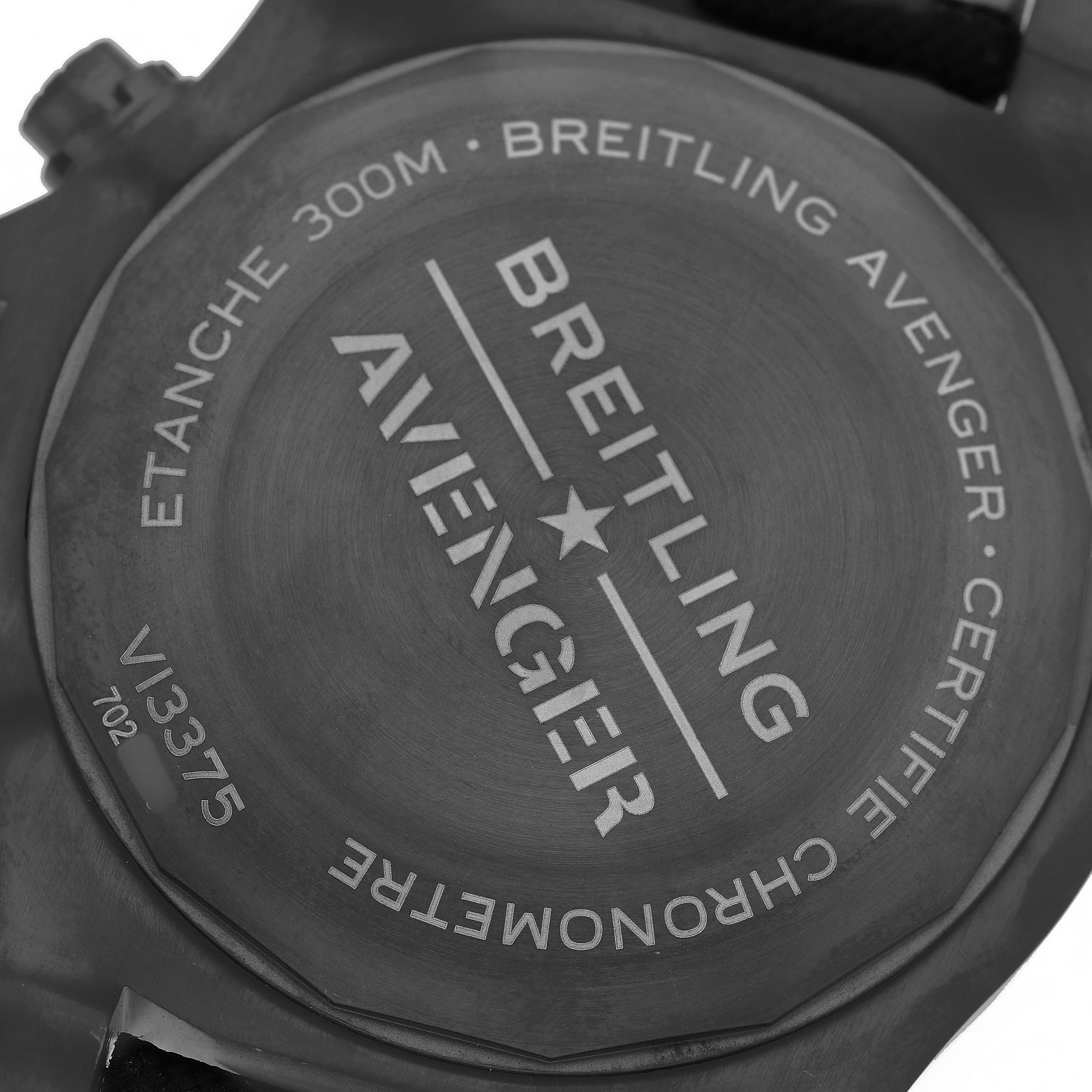 The image shows the case back of a Breitling Avenger V13375101C1X2 Men's Titanium Blue Dial watch, displaying engravings and specifications.