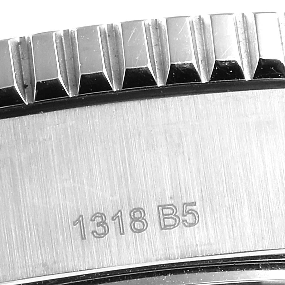 The image displays a close-up of the bezel and case side of the Breitling Superocean A17392 Men
s Stainless Steel Blue Dial A17392 Men
s Stainless Steel Blue Dial watch, showing a part of the serial number.