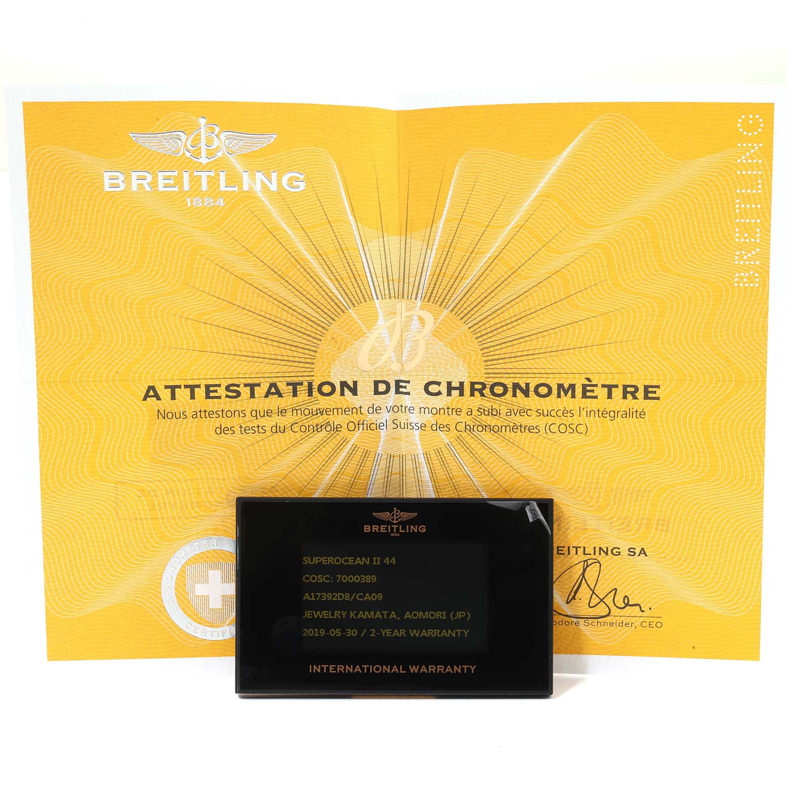 The image shows paperwork and a warranty card for a Breitling Superocean A17392 Men
s Stainless Steel Blue Dial A17392 Men
s Stainless Steel Blue Dial II 44 watch.