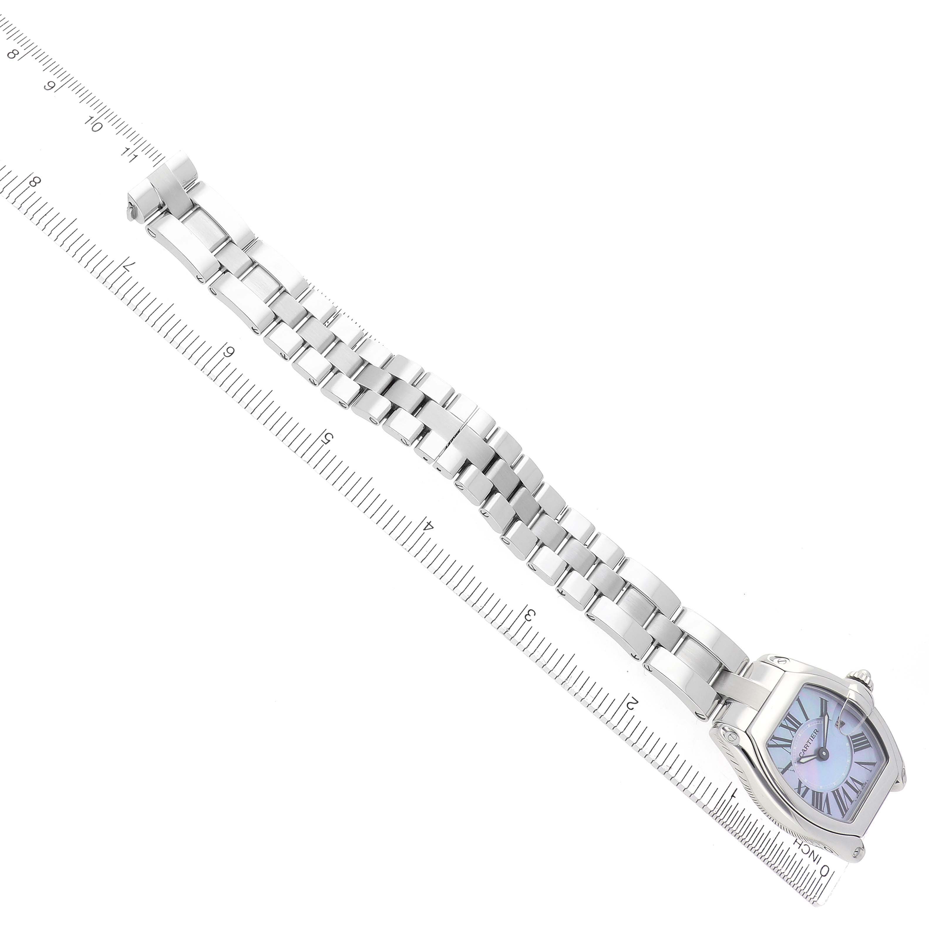 The Cartier Roadster W6206007 Women
s Stainless Steel Mother of Pearl Dial W6206007 Women
s Stainless Steel Mother of Pearl Dial watch is shown at an angle emphasizing its bracelet and face, aligned with a ruler for scale.