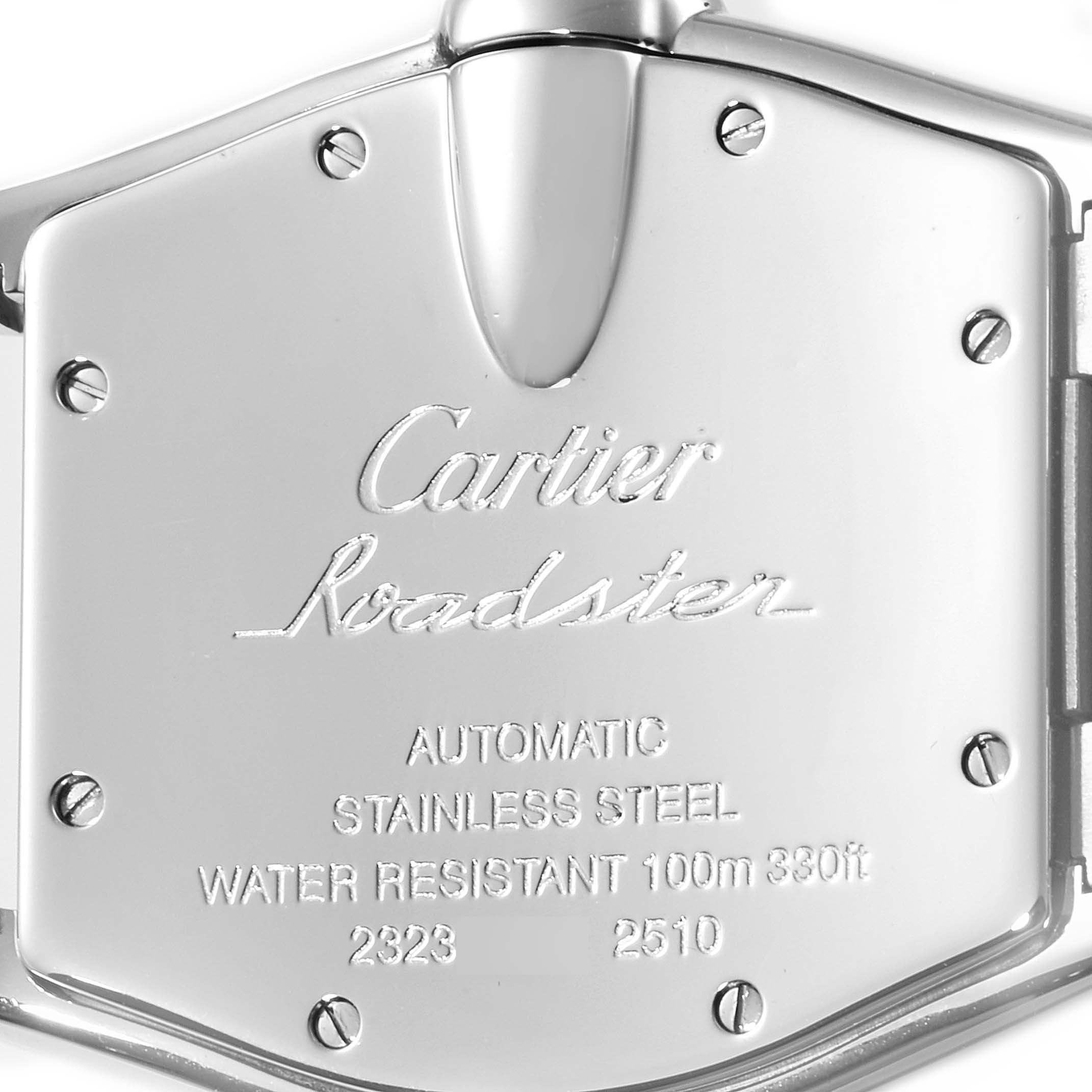 The image shows the back of a Roadster model watch by Cartier, displaying engravings and screws.
