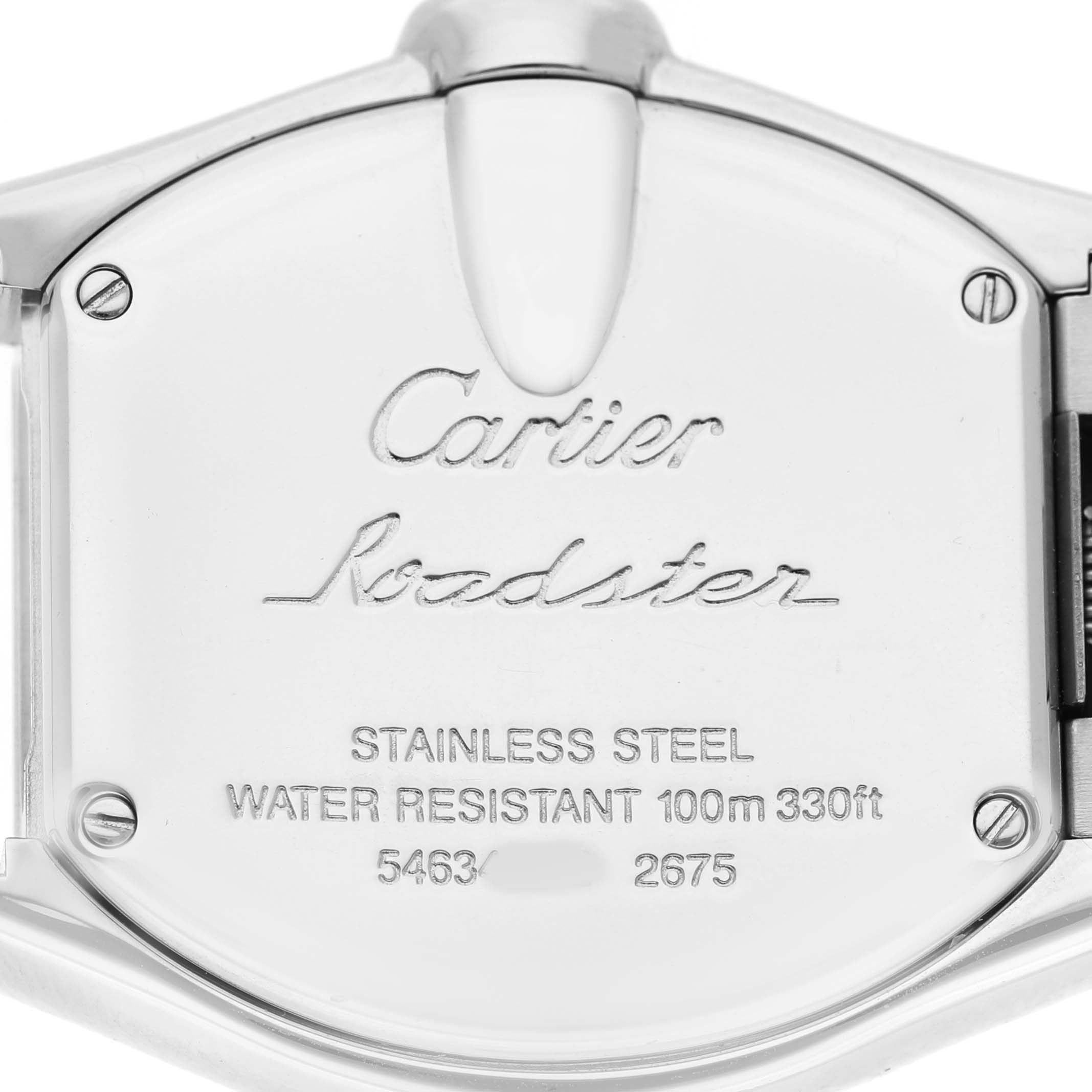 The image shows the back case of a Cartier Roadster W62016V3 Women's Stainless Steel Silver Dial watch, highlighting its inscriptions and stainless steel material.