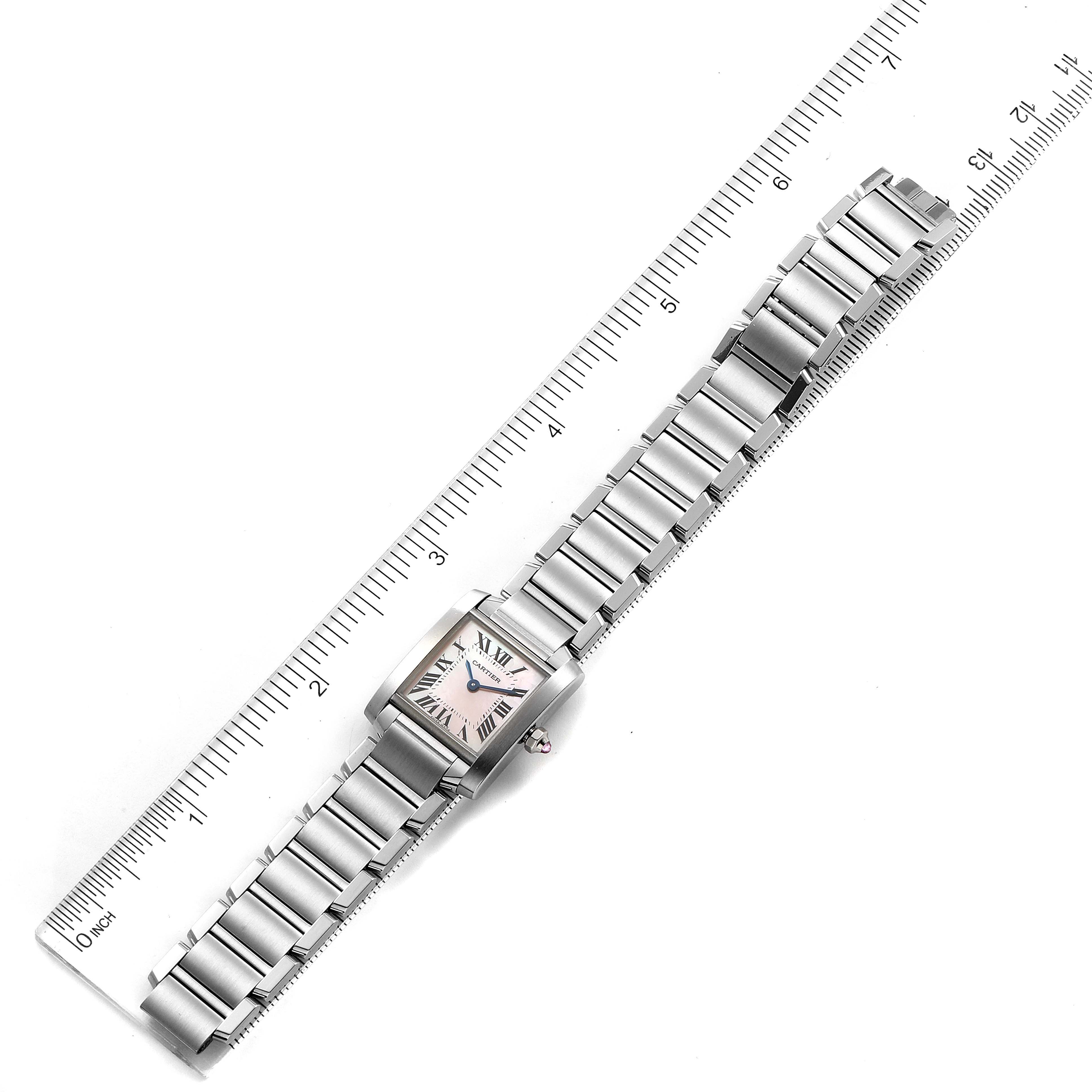 The Cartier Tank Francaise W51028Q3 Women's Stainless Steel Mother of Pearl Dial W51028Q3 Women's Stainless Steel Mother of Pearl Dial watch is shown from a top-down angle with a metal band, positioned alongside a ruler for scale.