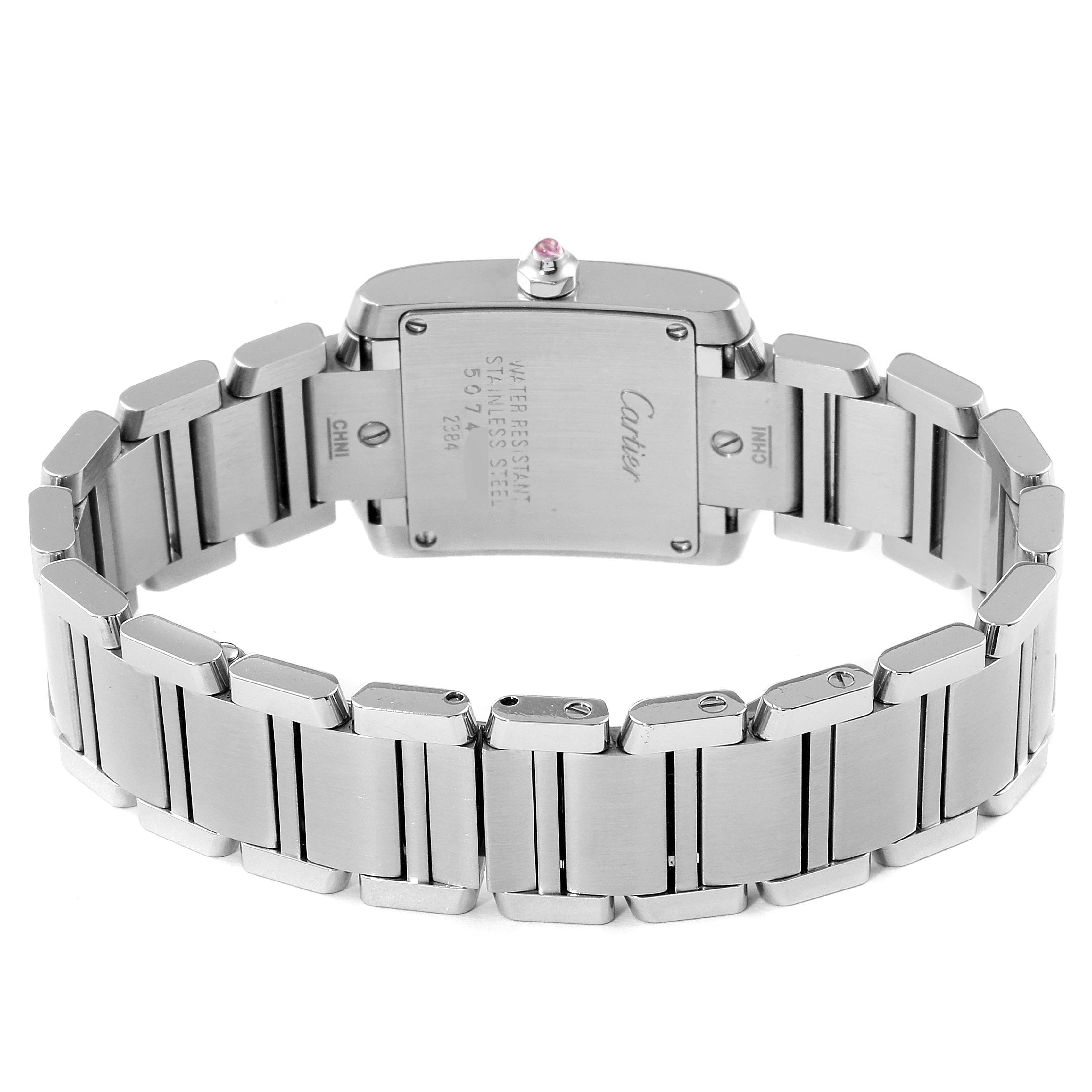The image shows the back view of a Cartier Tank Française watch, displaying the case back and stainless steel bracelet.