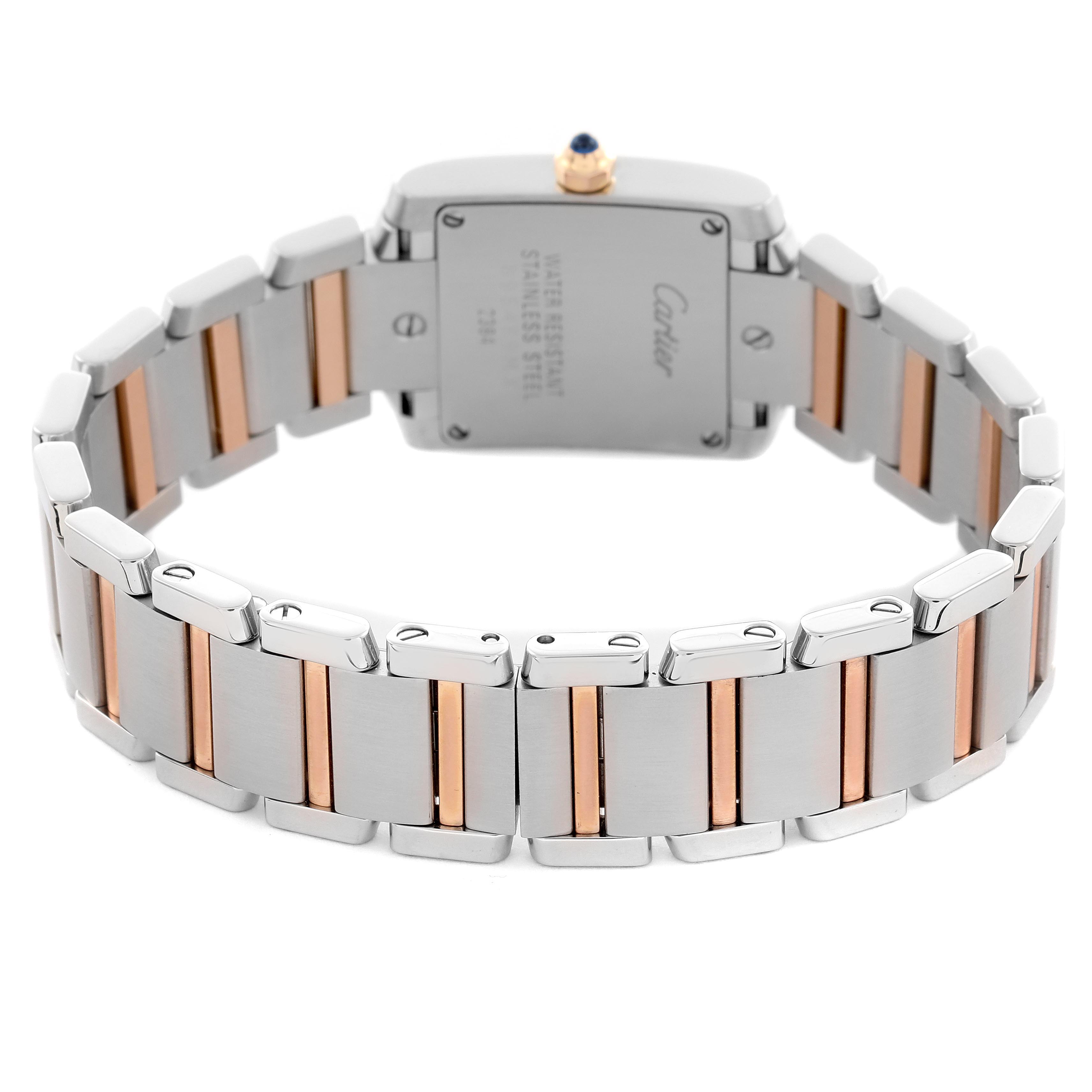 The image shows the back view of the Cartier Tank Française, highlighting the clasp, case back, and two-tone bracelet.