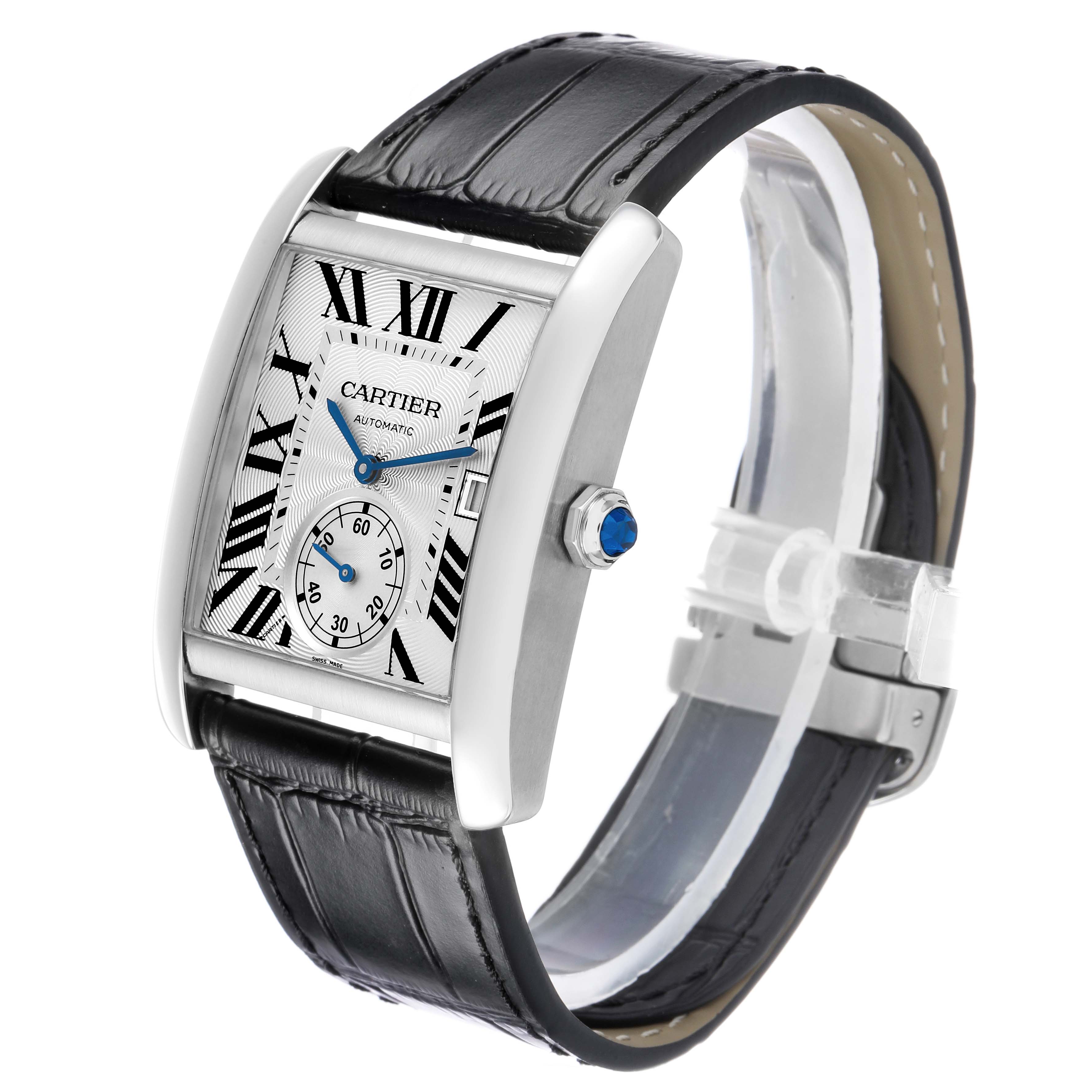 The Cartier Tank MC W5330003 Men's Stainless Steel Silver Dial watch is shown at a three-quarter angle, highlighting the dial, Roman numerals, sub-dial, black leather strap, and crown with a blue gem.