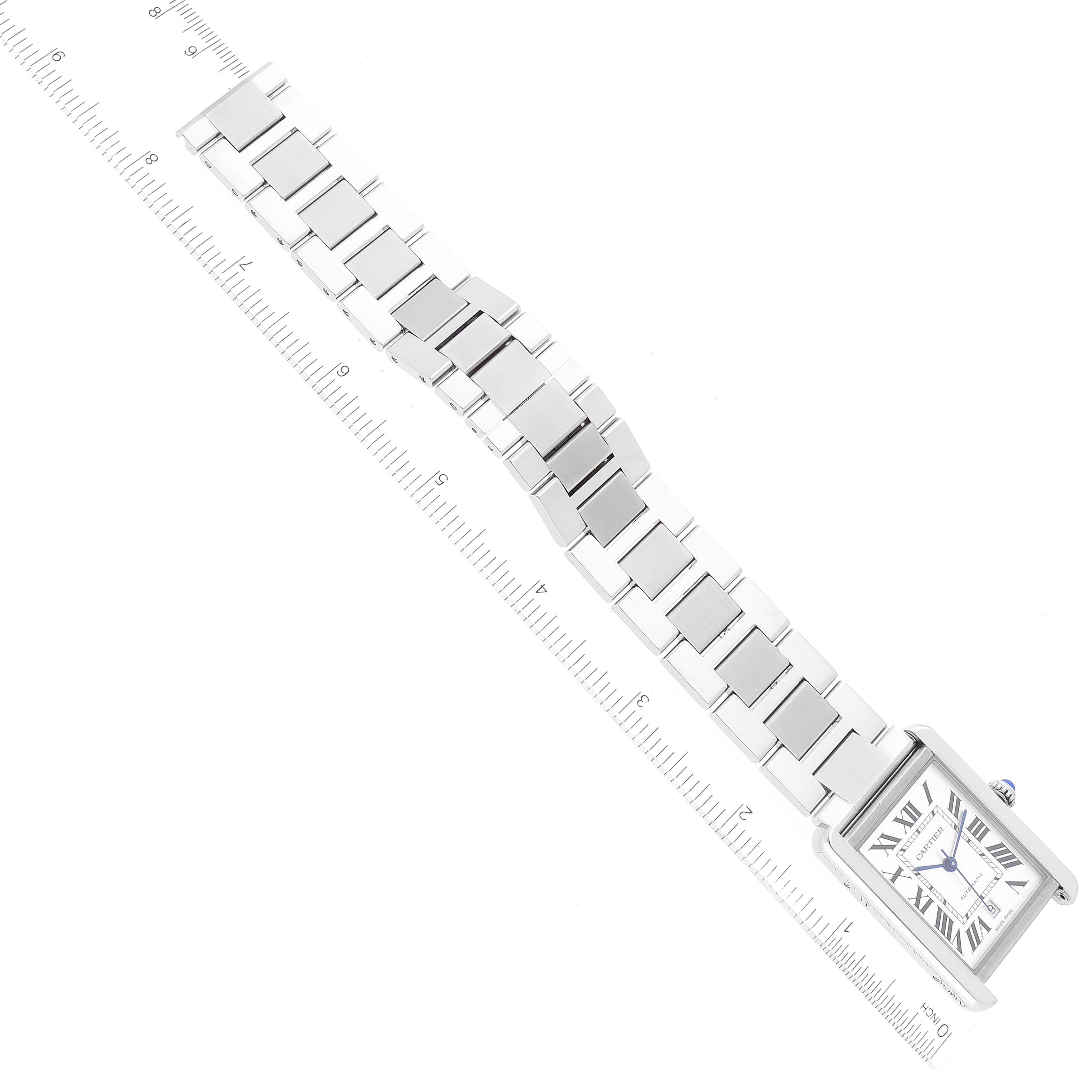 This image shows a flat lay of a Cartier Tank Solo W5200028 Men's Stainless Steel Silver Dial W5200028 Men's Stainless Steel Silver Dial watch, displaying its face, bracelet, and surrounding ruler measurement.