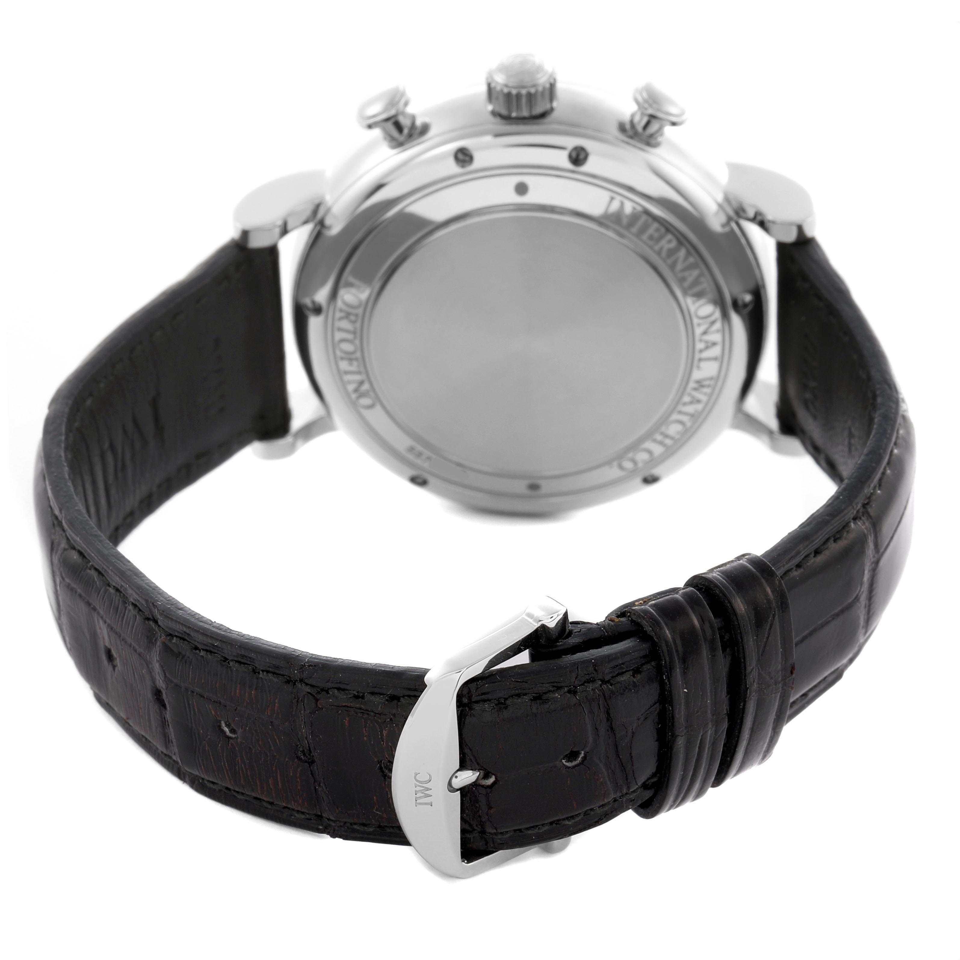 The IWC Portofino IW391022 Men
s Stainless Steel Silver Dial IW391022 Men
s Stainless Steel Silver Dial watch is shown from the back, highlighting the case back, crown, pushers, and leather strap with a buckle.