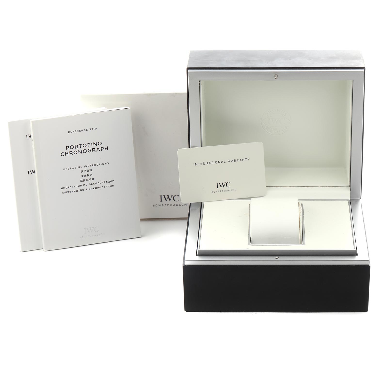 The image shows an IWC Portofino IW391022 Men
s Stainless Steel Silver Dial IW391022 Men
s Stainless Steel Silver Dial watch box, warranty card, and instruction manuals from a slightly elevated angle.
