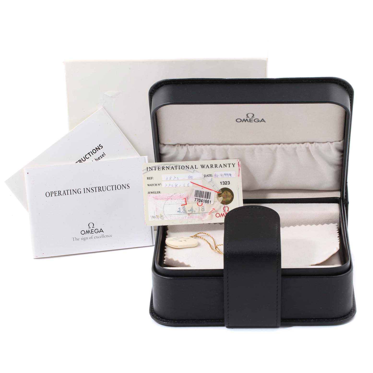 The image displays the Omega Speedmaster 3570.50.00  Men
s Stainless Steel Black Dial 3570.50.00  Men
s Stainless Steel Black Dial
s packaging, including the watch box, international warranty card, and operating instructions.