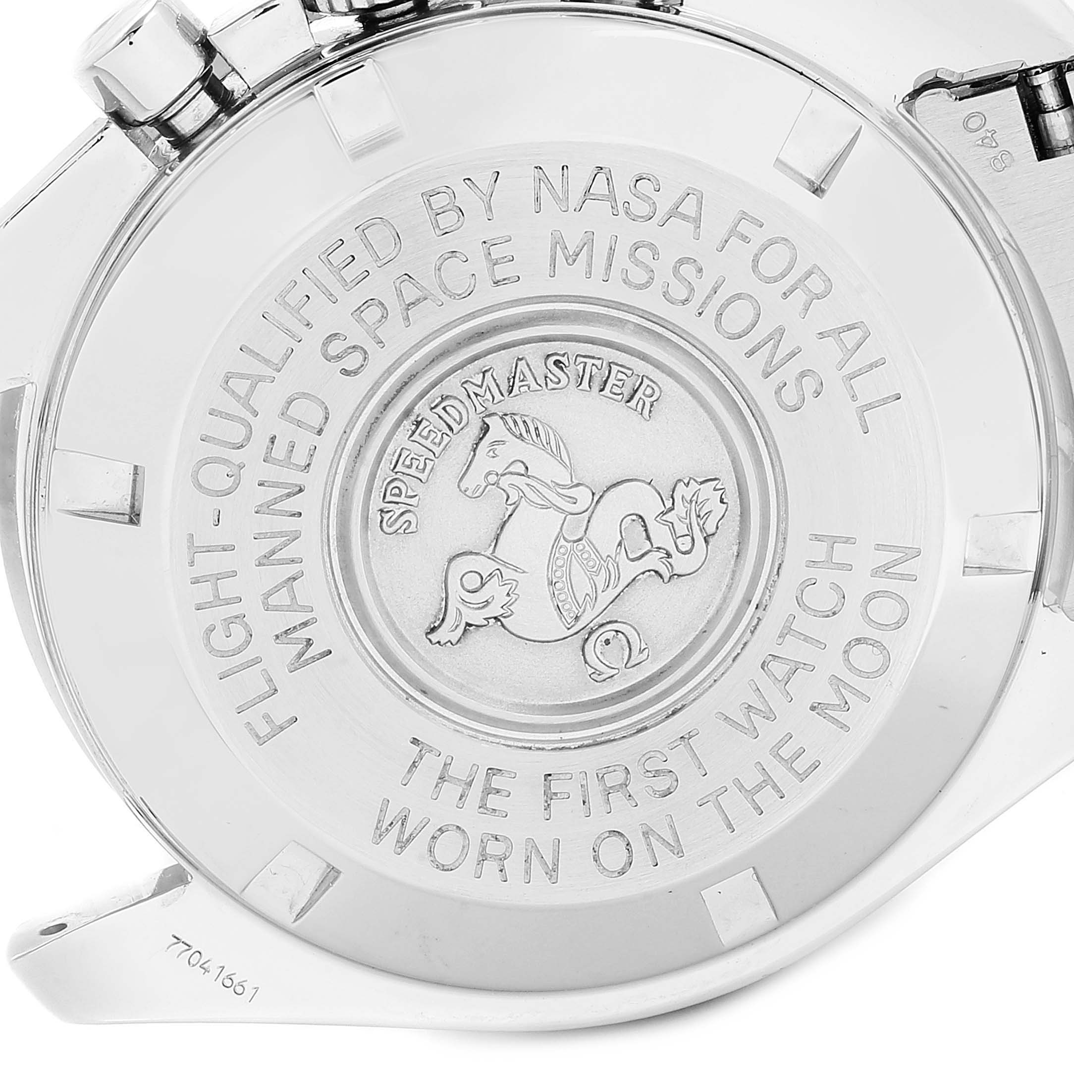 The image shows the back case of an Omega Speedmaster 3570.50.00  Men
s Stainless Steel Black Dial 3570.50.00  Men
s Stainless Steel Black Dial watch with engraved text and emblem.