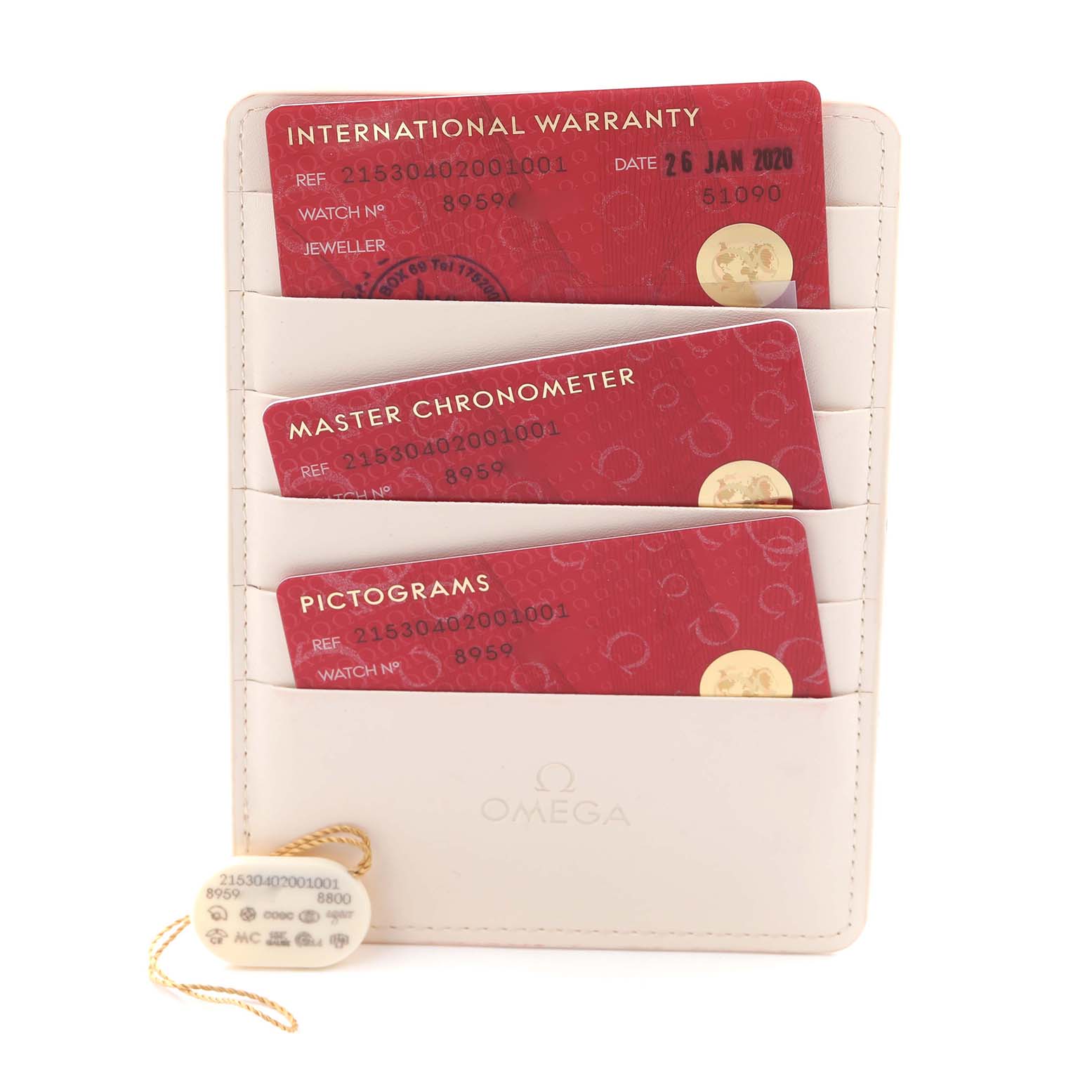 The image shows Omega Planet Ocean 215.30.40.20.01.001 Men
s Stainless Steel Black Dial 215.30.40.20.01.001 Men
s Stainless Steel Black Dial accessories, including warranty cards and a serial tag, arranged vertically in a holder.