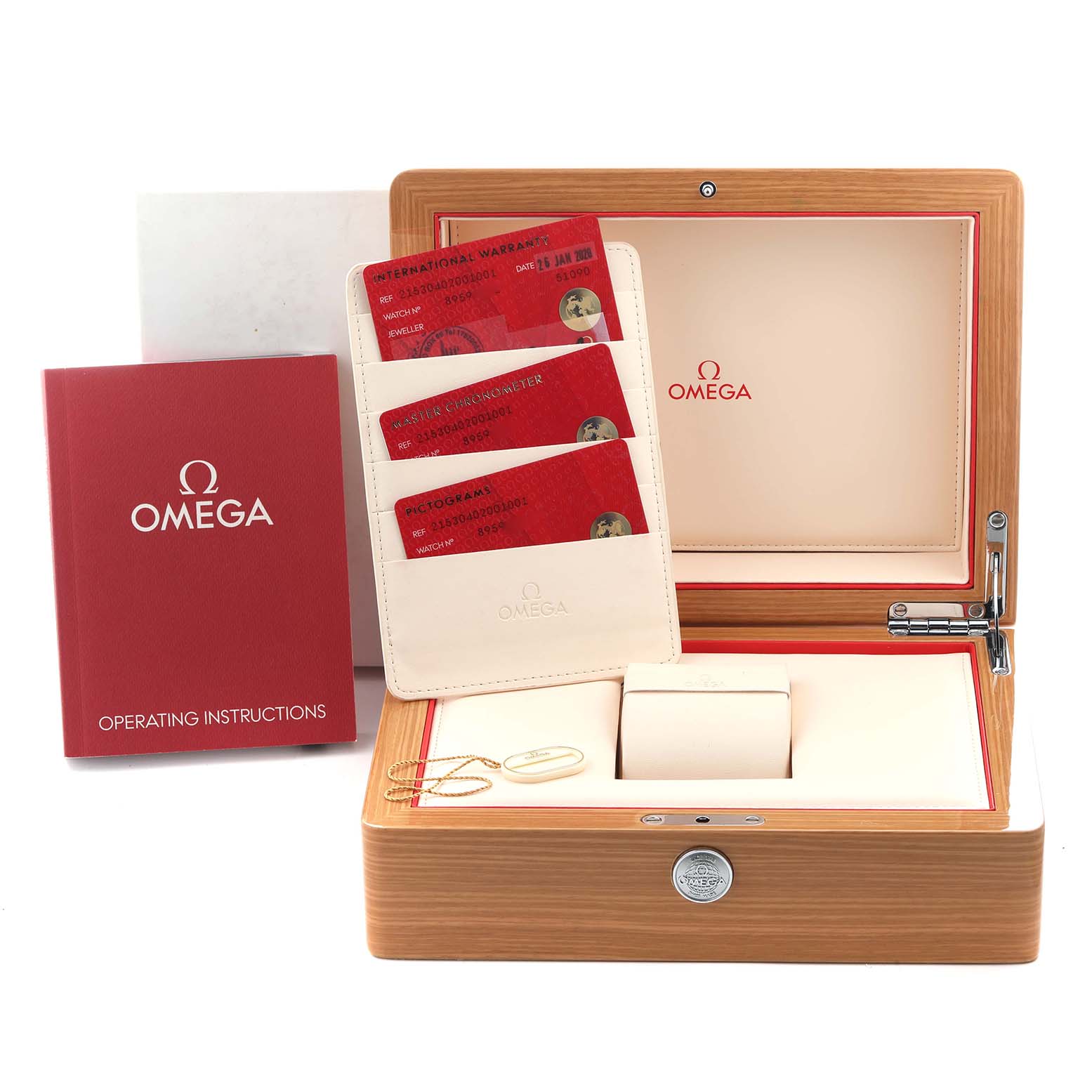 The image shows the Omega Planet Ocean 215.30.40.20.01.001 Men
s Stainless Steel Black Dial 215.30.40.20.01.001 Men
s Stainless Steel Black Dial watch accessories, including a box, cards, and manual, viewed from the front.