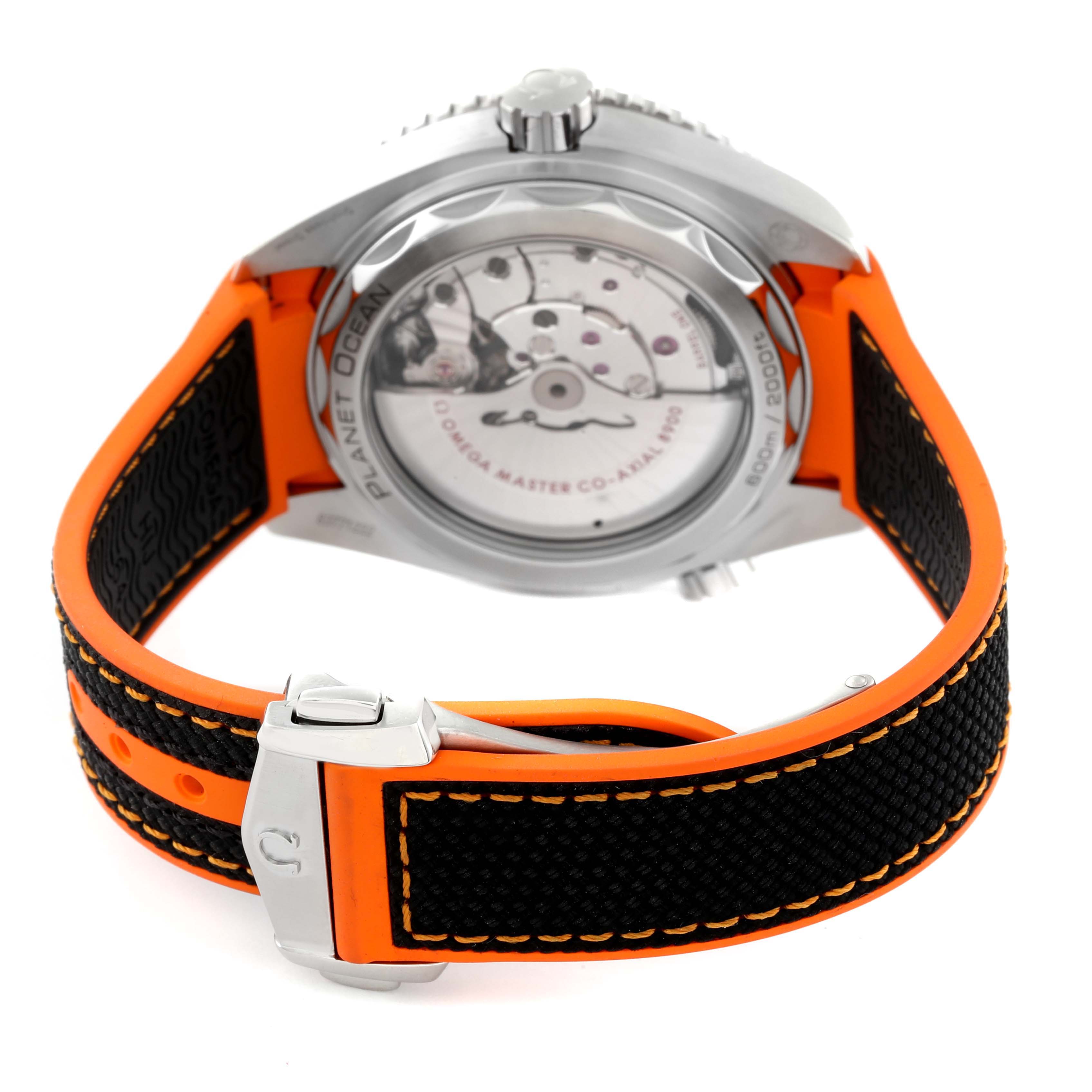 The image shows the back case and strap of an Omega Planet Ocean 215.32.44.21.01.001 Men's Stainless Steel Black Dial 215.32.44.21.01.001 Men's Stainless Steel Black Dial watch, highlighting the visible movement and orange-accented band.