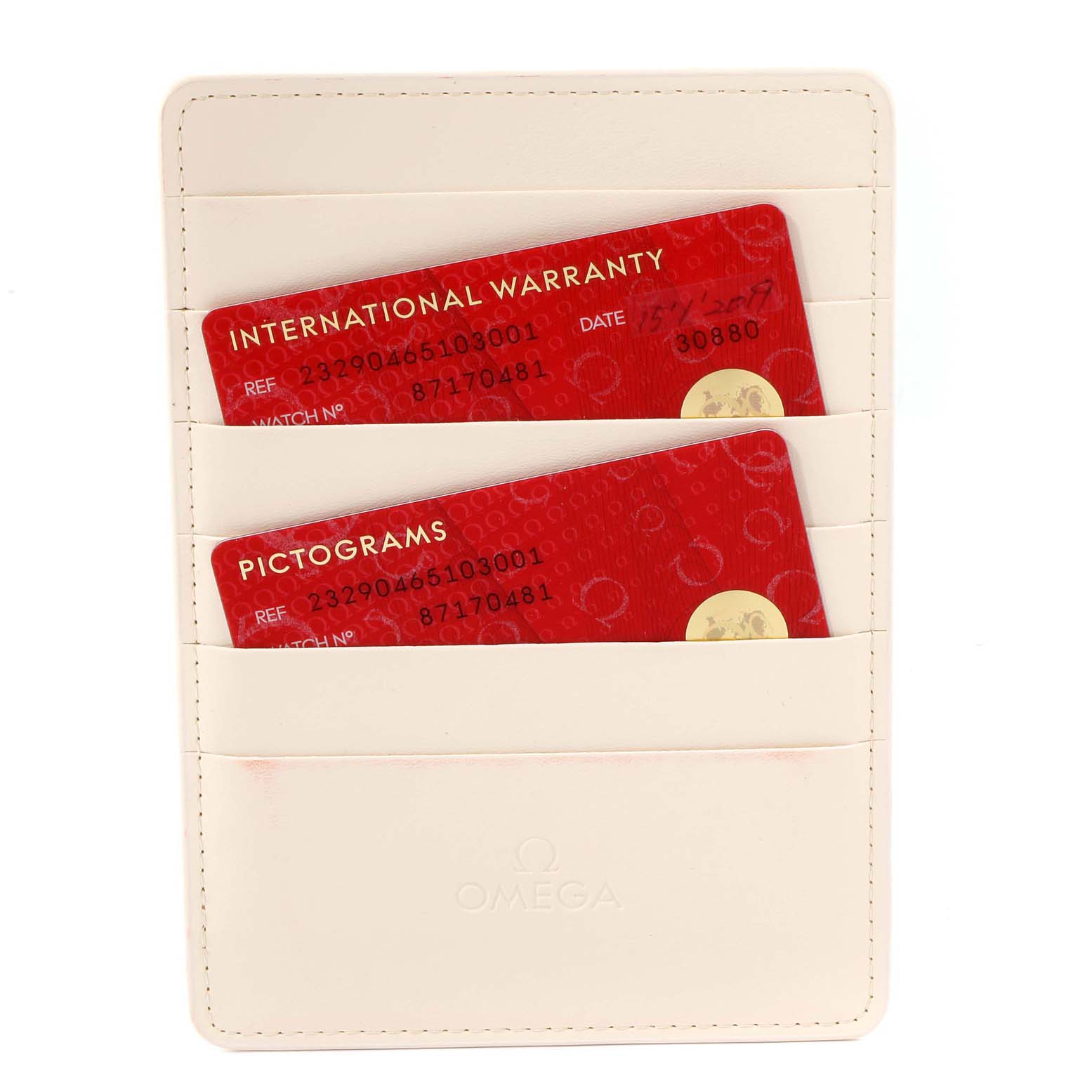 The image shows a beige Omega cardholder with two red cards labeled "International Warranty" and "Pictograms" for the Planet Ocean model.