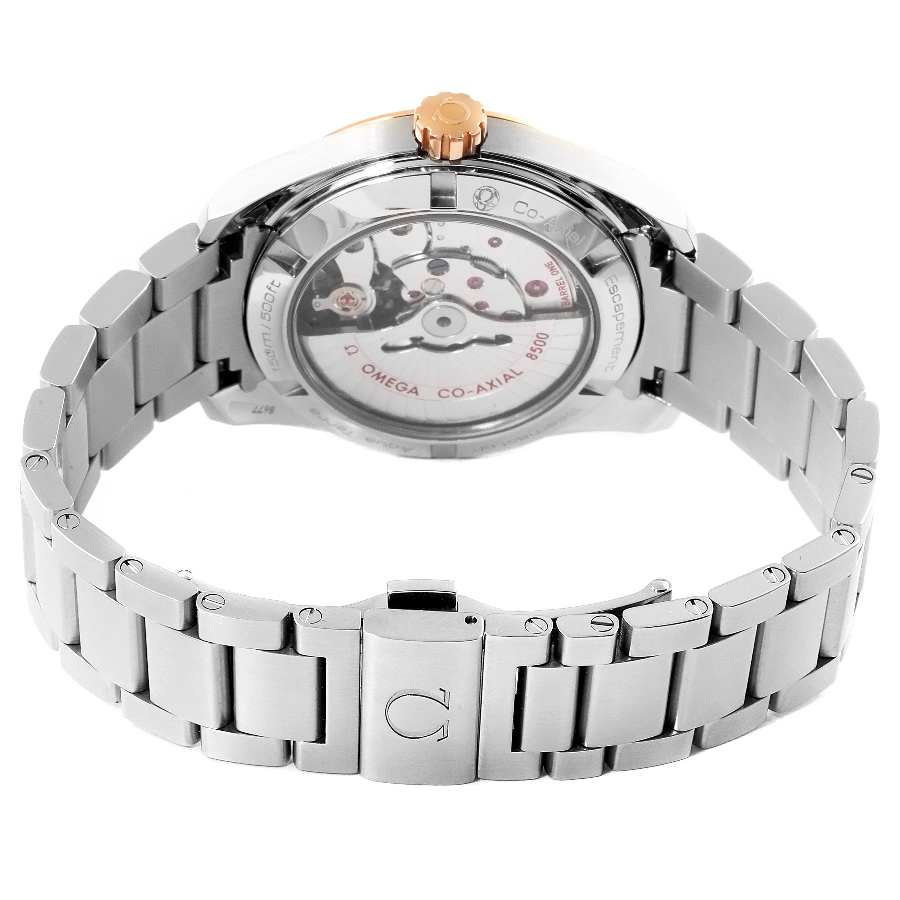 The image shows the back view of the Omega Aqua Terra 231.20.39.21.06.003 Men
s Steel and Gold (two tone) Grey Dial 231.20.39.21.06.003 Men
s Steel and Gold (two tone) Grey Dial watch, highlighting its co-axial movement and metal bracelet.