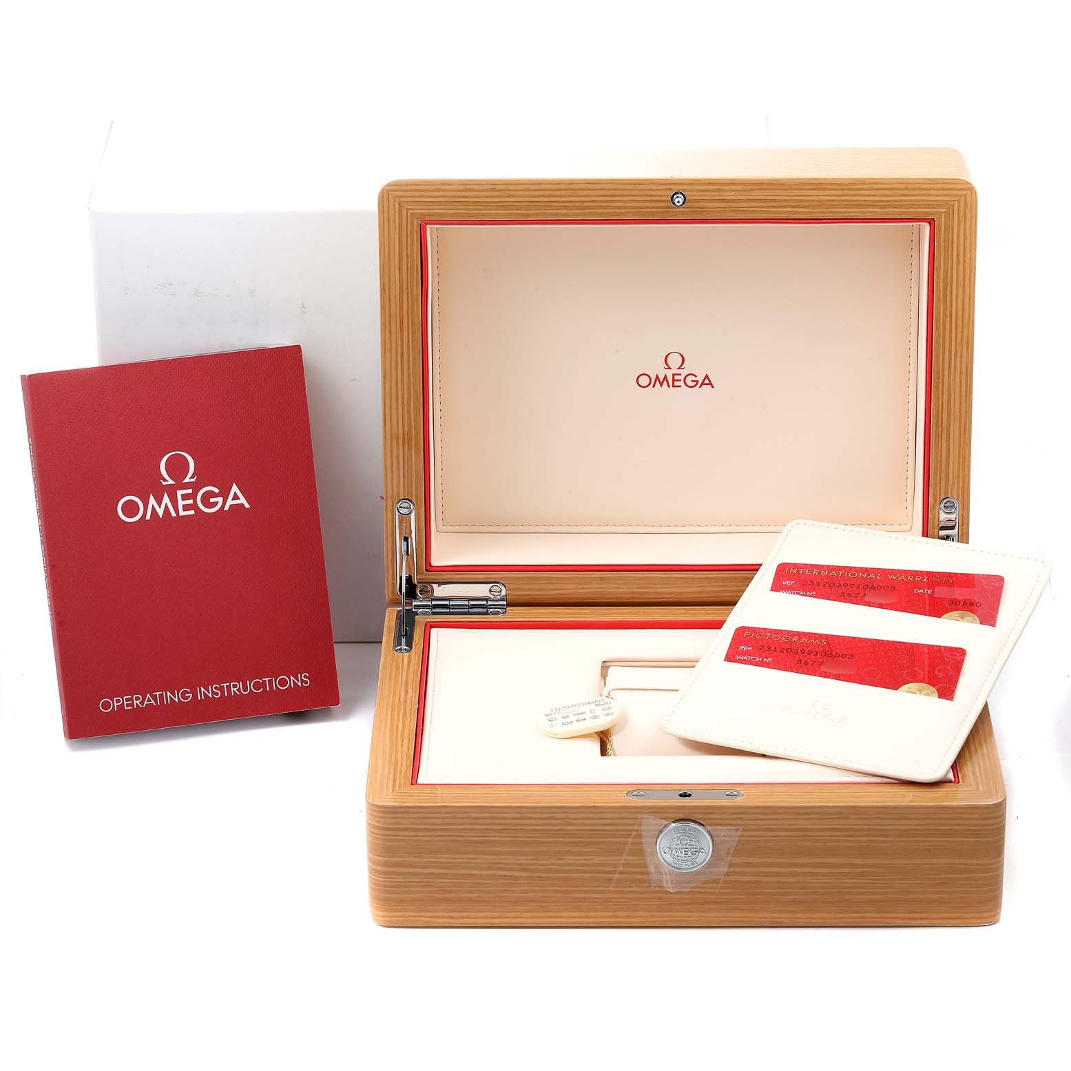 The image shows the packaging and accessories of an Omega Aqua Terra 231.20.39.21.06.003 Men
s Steel and Gold (two tone) Grey Dial 231.20.39.21.06.003 Men
s Steel and Gold (two tone) Grey Dial watch, including the open box, operating instructions, and warranty cards.