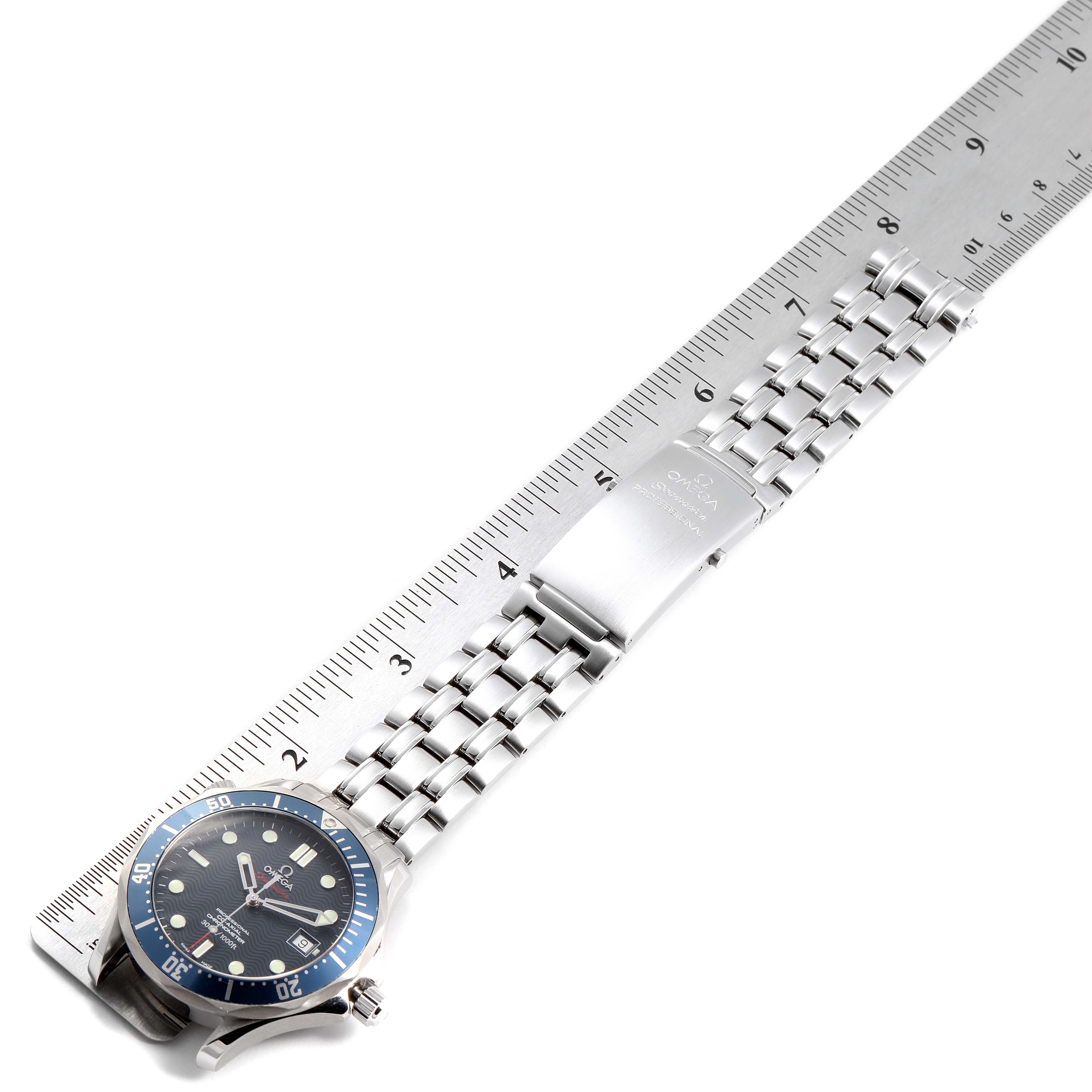 This image shows the Omega Seamaster 2220.80.00 Men
s Stainless Steel Blue Dial 2220.80.00 Men
s Stainless Steel Blue Dial watch laid flat with its metal bracelet and clasp visible, measured against a ruler.