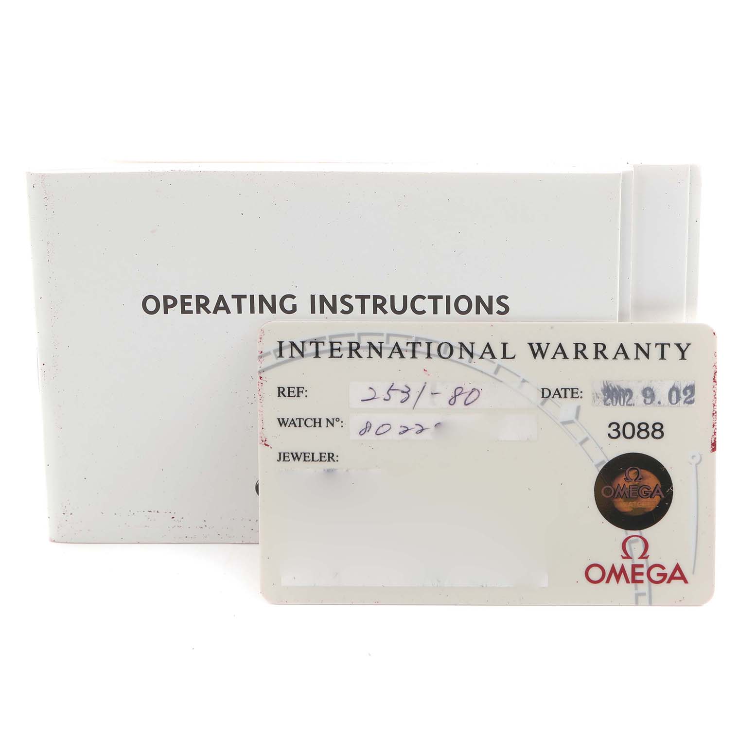 The image shows the Omega Seamaster 2531.80.00 Men
s Stainless Steel Blue Dial 2531.80.00 Men
s Stainless Steel Blue Dial
s operating instructions and an international warranty card placed at an angle.