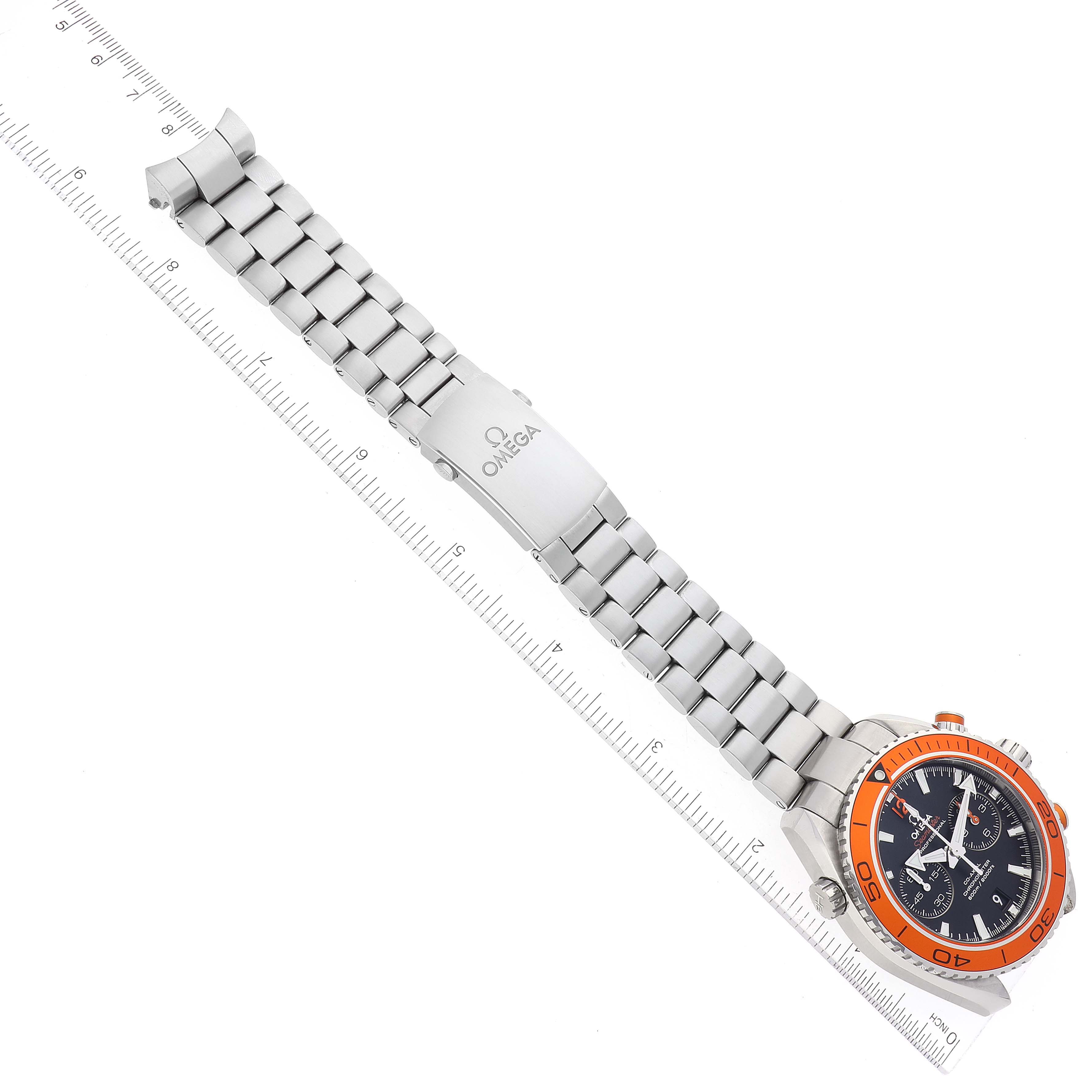 This top-down view of the Omega Planet Ocean 232.30.46.51.01.002 Men's Stainless Steel Black Dial 232.30.46.51.01.002 Men's Stainless Steel Black Dial watch shows the full bracelet and the dial with an orange bezel.