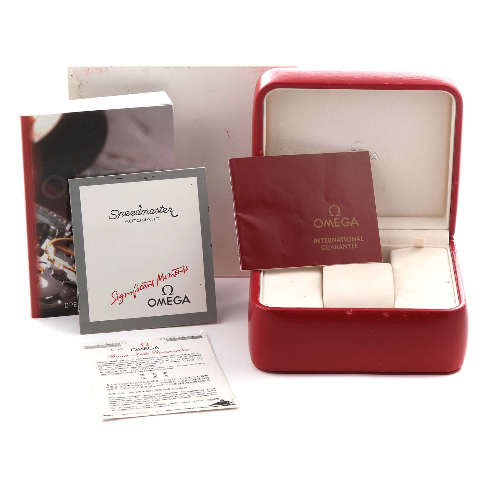 The image shows the packaging and manuals for an Omega Speedmaster ST175.0032 Men
s Stainless Steel White Dial ST175.0032 Men
s Stainless Steel White Dial, including a red box and various booklets.