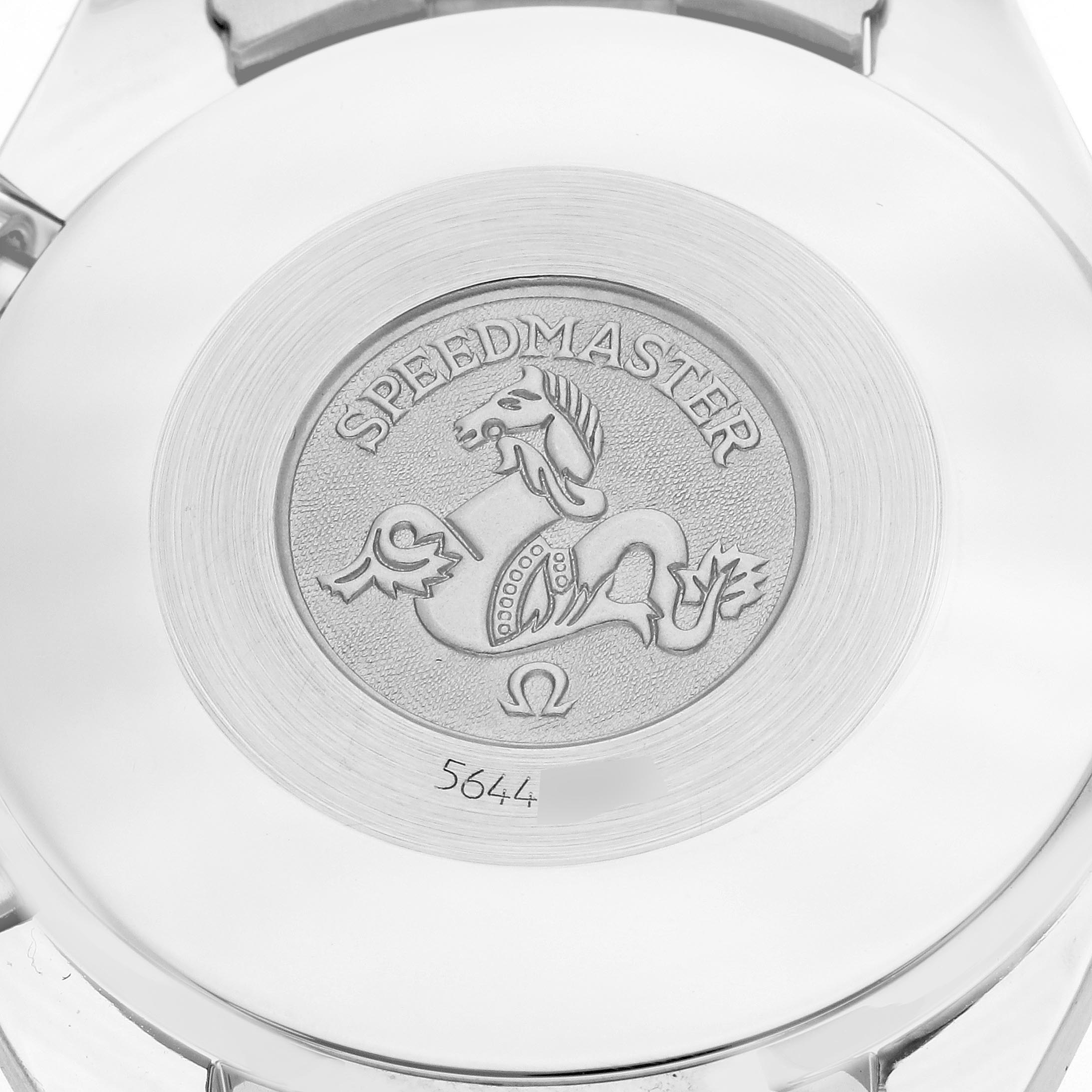 The image shows the case back of an Omega Speedmaster 3510.12.00 Men
s Stainless Steel Yellow Dial 3510.12.00 Men
s Stainless Steel Yellow Dial watch, featuring an engraved emblem and serial number.