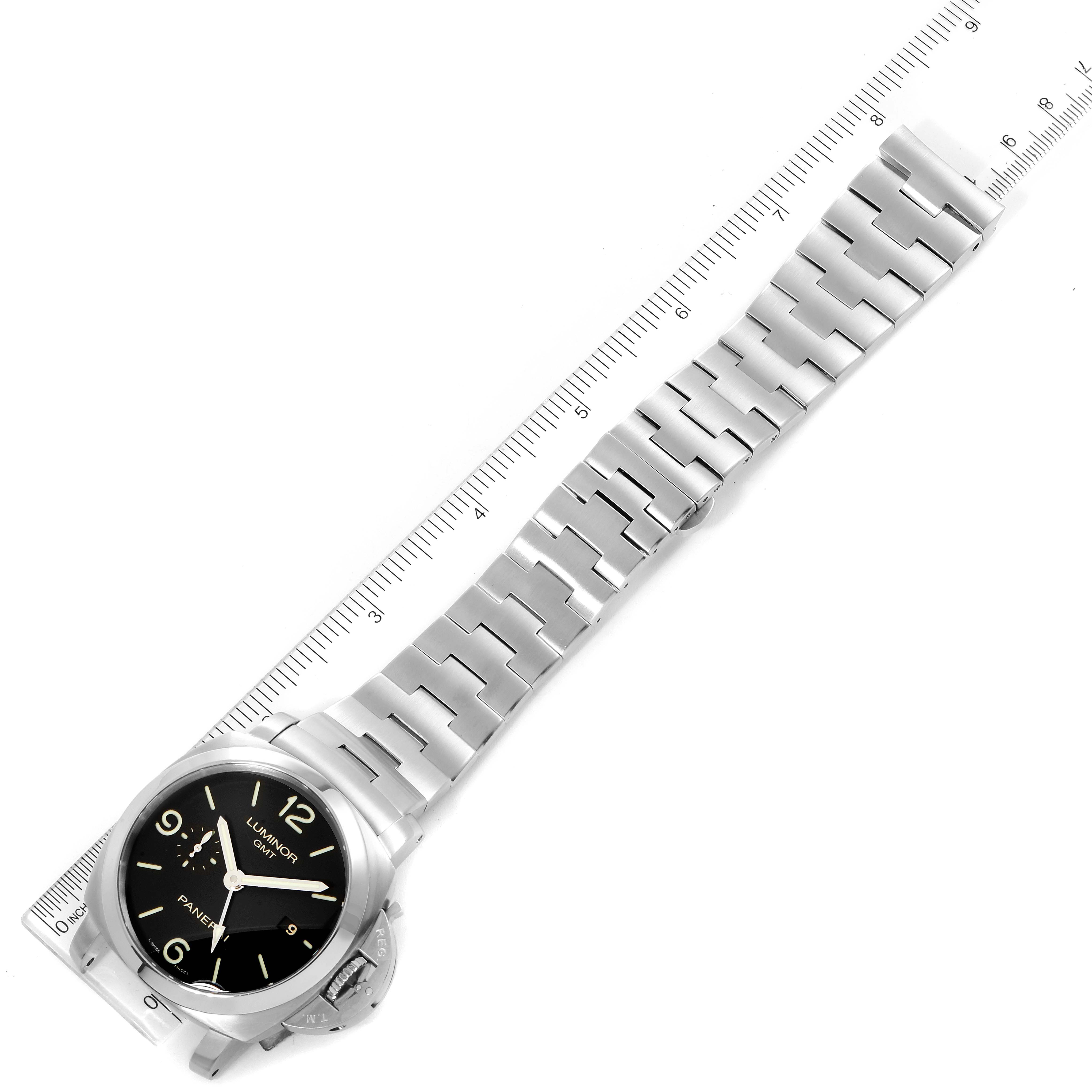 The image shows a Panerai Luminor PAM00329 Men
s Stainless Steel Black Dial PAM00329 Men
s Stainless Steel Black Dial watch laid flat with a metal bracelet, partially framed by a measurement scale.