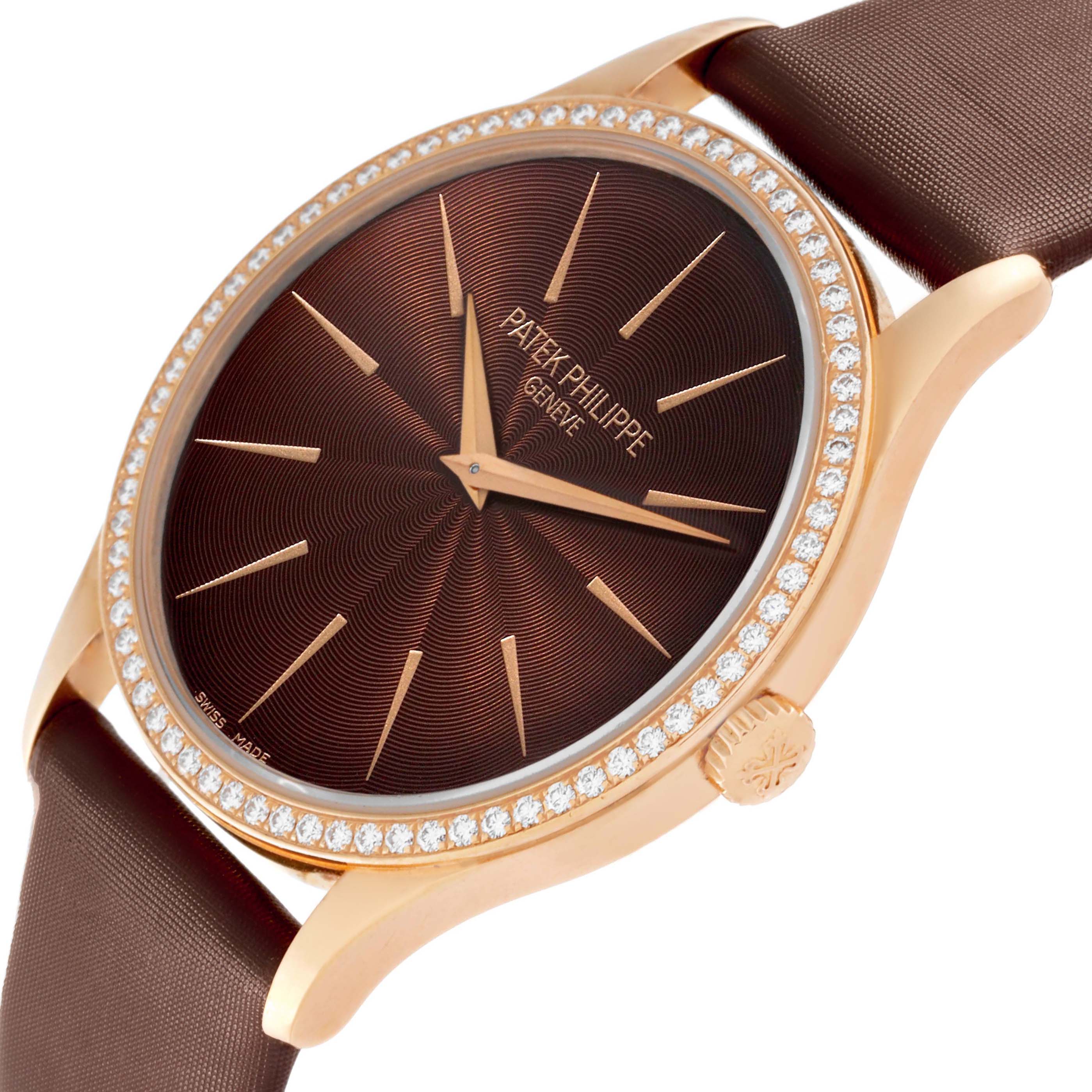 The Patek Philippe Calatrava 4897R-001 Womens Rose Gold Brown Dial watch is shown at an angled view, highlighting the brown dial, diamond-studded bezel, and crown.