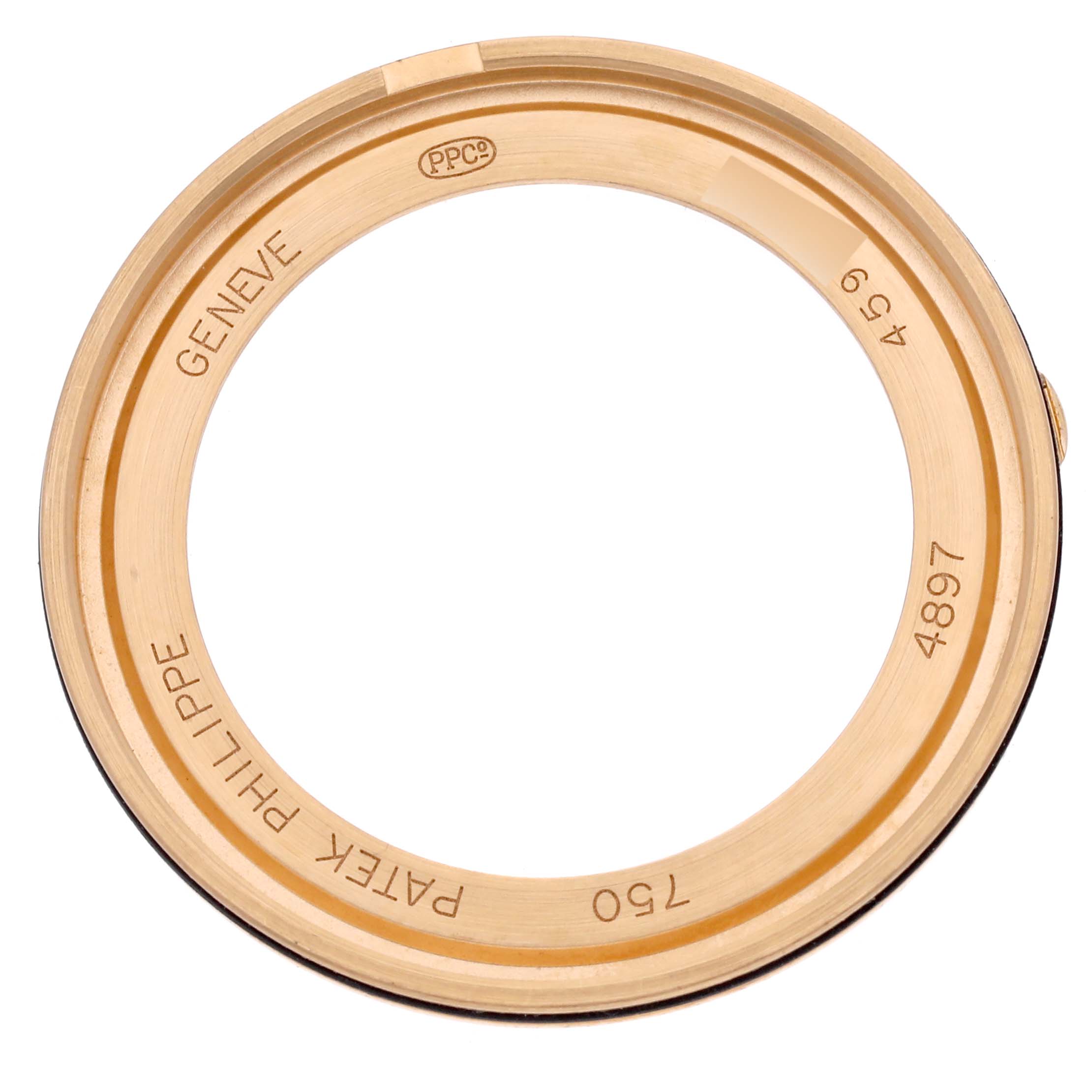 The image shows the back view of a Calatrava model bezel by Patek Philippe, highlighting engravings and markings.