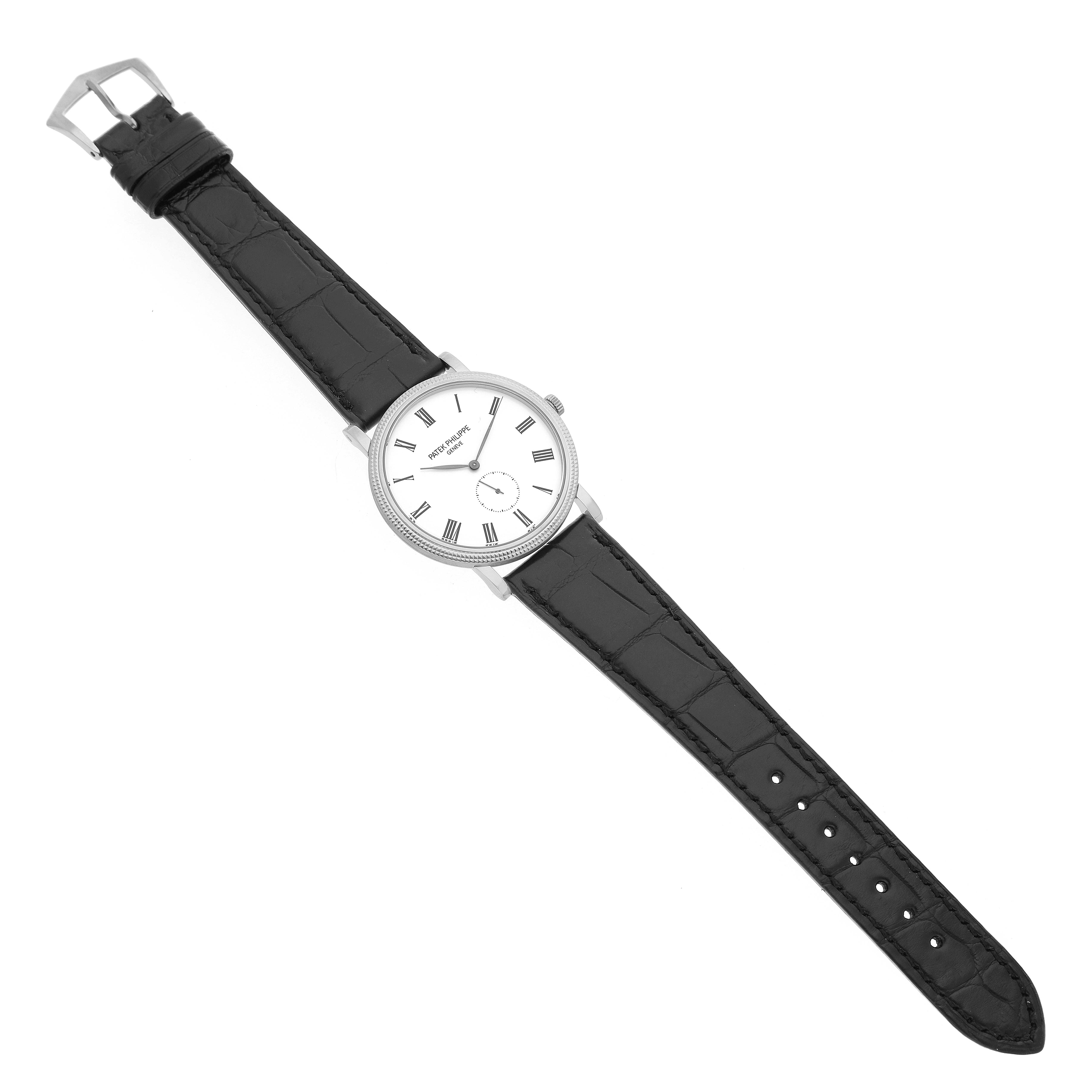 The Patek Philippe Calatrava 5119G-001 Men's White Gold White Dial watch is shown from a top-down angle, displaying the face, bezel, crown, and entire black leather strap.