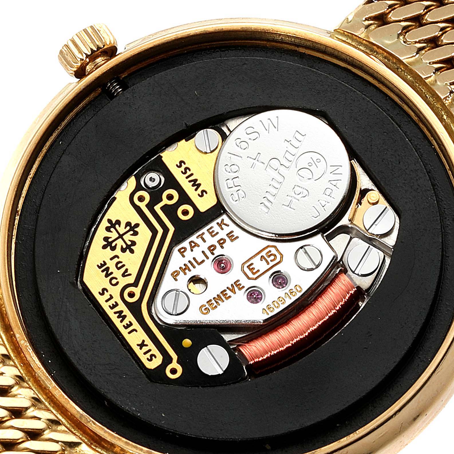 This image shows the inner mechanism of a Patek Philippe Calatrava 4819 Women's Yellow Gold White Dial 4819 Women's Yellow Gold White Dial watch from the back, including the movement and battery.