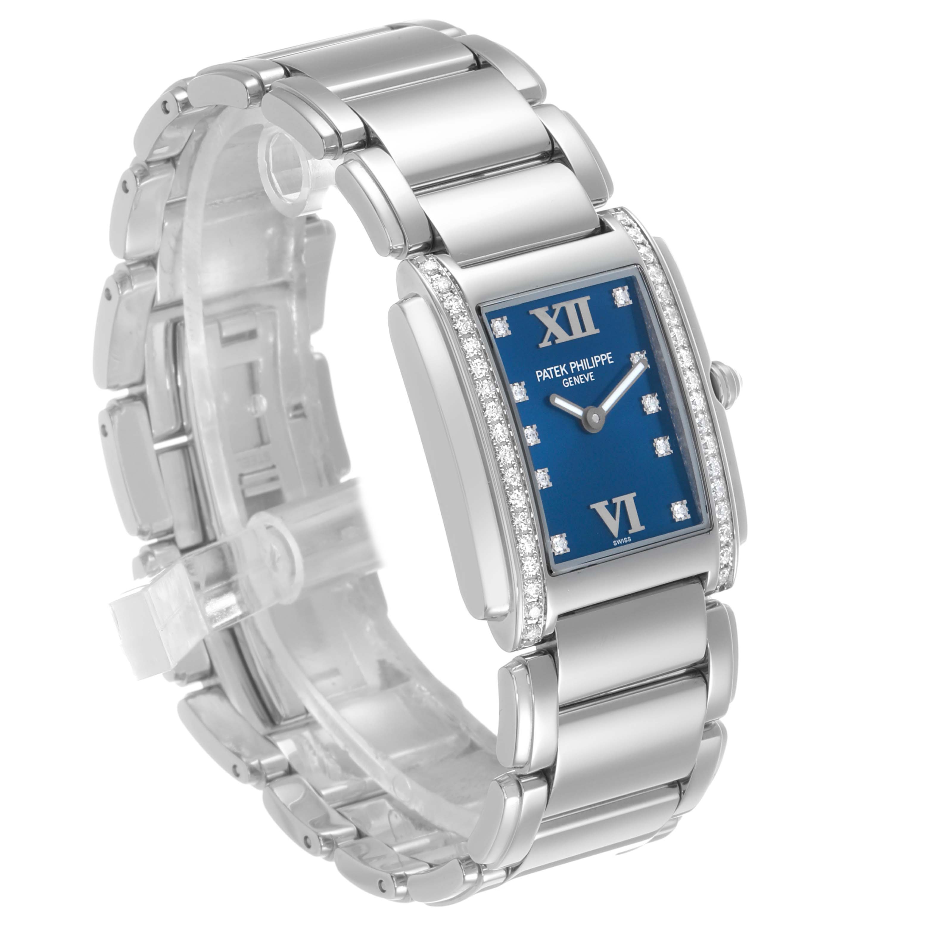 The Patek Philippe Twenty-4 4910A Women's Stainless Steel Blue Dial watch is shown at a slight angle highlighting the blue dial, bracelet, and side profile with diamond accents.