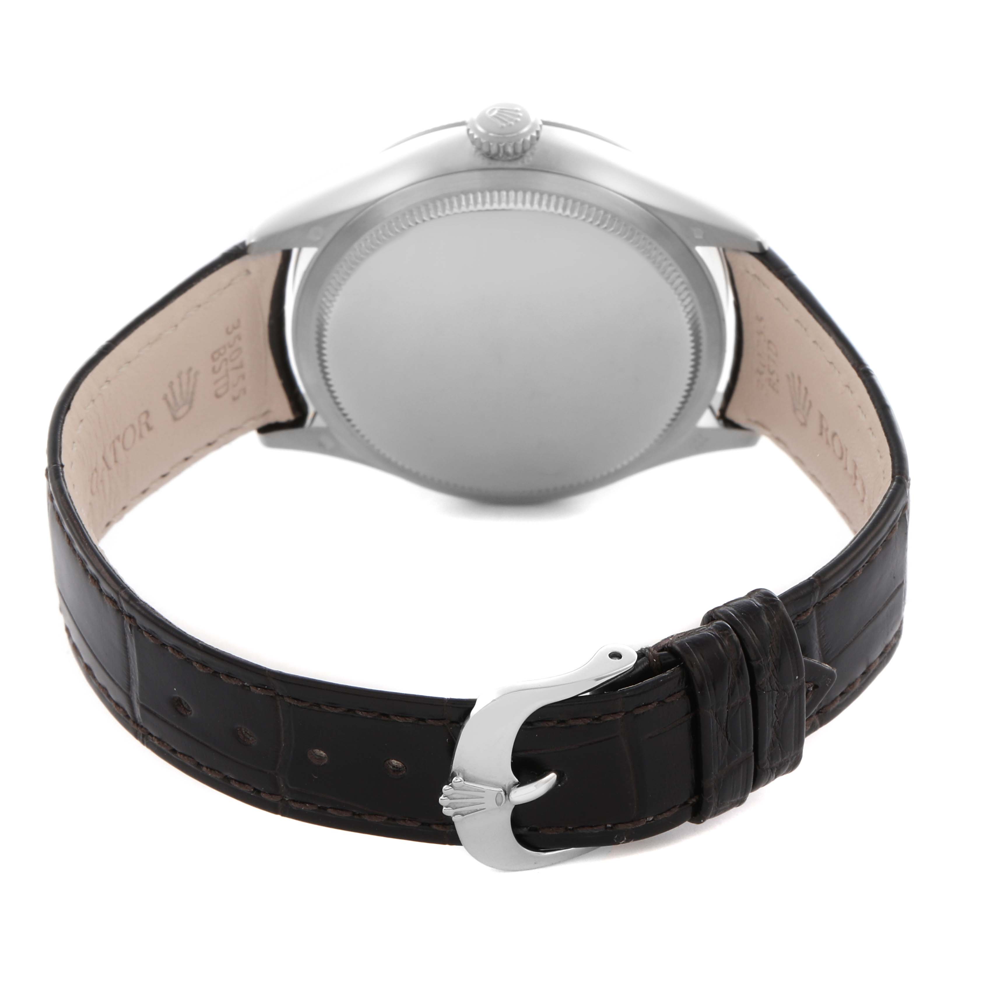 The image shows the back view of a Rolex Cellini 50529 Men
s White Gold Silver Dial 50529 Men
s White Gold Silver Dial watch, highlighting the case back, crown, and leather strap with a clasp.
