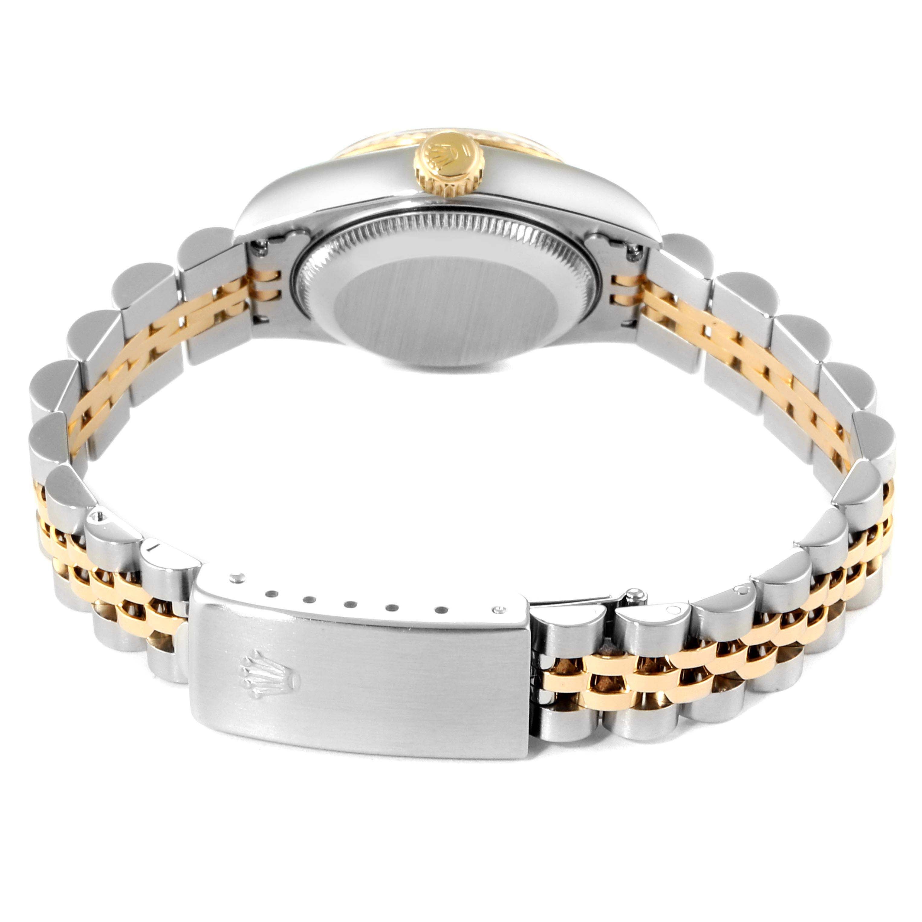 The side and back view of a Rolex Datejust 69173 Women's Steel and Gold (two tone) Champagne Dial 69173 Women's Steel and Gold (two tone) Champagne Dial watch showing the case back, crown, and two-tone bracelet with the Rolex clasp.