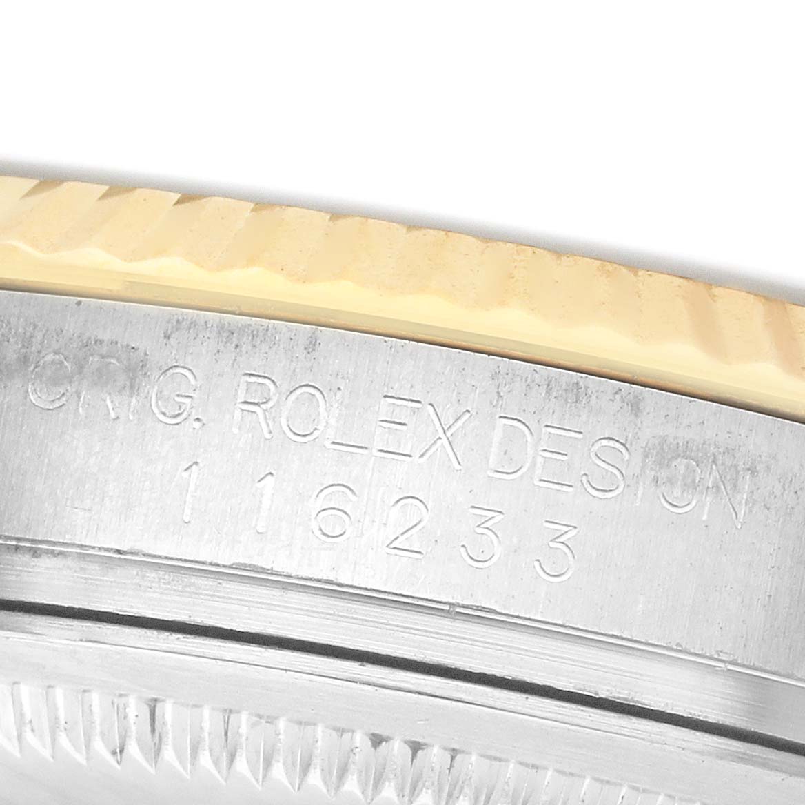 The image shows a close-up of the case side of a Rolex Datejust 116233 Men's Stainless Steel Champagne Dial, highlighting the model number engraving.